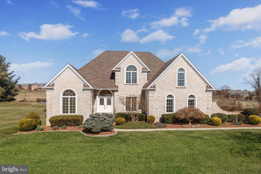 A fine tradition of luxury and livability and perhaps the most beautiful setting in Todd Lakes. This exquisite home combines quality construction with a universal design on a gorgeous nearly 2.5 acres lot with unparalleled views. Double doors greet you as you enter the two-story foyer with an open flow into the 2-story great room with skylights and beautiful views from the wall of windows and French doors leading to the deck. The expansive kitchen & family room opening to the rear yard is perfect for entertaining. A bright and open design is enhanced throughout with a high cove ceiling in the living room, tray ceiling in the dining room, vaulted ceiling in the main level primary bedroom, and 8’ to 11’ ceilings in the three upper-level bedrooms. Approximately 3,000 finished sq ft above grade and just over 2,000 unfinished sq ft below grade with high ceilings and walkout to rear yard. New carpet installed in all bedrooms & living room. A perfect mix bringing together seamless indoor-outdoor living and perhaps the most beautiful setting in Todd Lakes with unparalleled views. This home is equipped with a whole-house gas generator and dehumidifier, two-200-amp electric panels, and a buried propane tank. All are conveniently located just a short drive to Maryland Golf & Country Club and accessible from all directions.