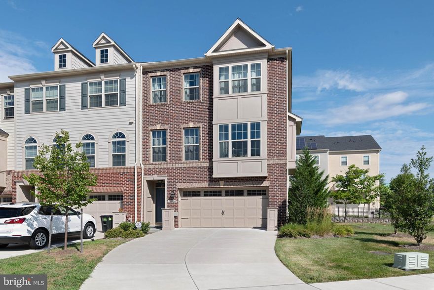 Picture perfect property - make sure to watch the video! This former model home in Hunt Valley Overlook will feel like you just stepped into a catalog. This brick-front beauty was built with the highest quality finishes and upgrades throughout and is 3.0 Energy Star Certified. The gourmet kitchen is a chef's dream with Whirlpool stainless steel appliances, granite countertops, custom tile backsplash, double wall oven, upgraded 42" cabinetry, a gas cooktop, and an extra large island with a custom coffered ceiling above it. Bright and sunny throughout, this home has many lovely touches such as the charming window seat in the living room, crown molding, designer custom accent walls, top-of-the-line light fixtures, upgraded recessed lighting throughout, Carrara marble in the bathrooms, hardie plank siding, and speakers installed in several key spaces! The sumptuous owner's suite is extremely spacious, complete with a vaulted ceiling, huge walk-in closet, and a luxe en-suite bath with a double vanity, soaking tub, and gorgeous tile work. Enjoy the convenience of the attached 2 car garage, large Trex deck off the kitchen/dining area, and the patio leading out from the main level walkout. This pristine home is the whole package!