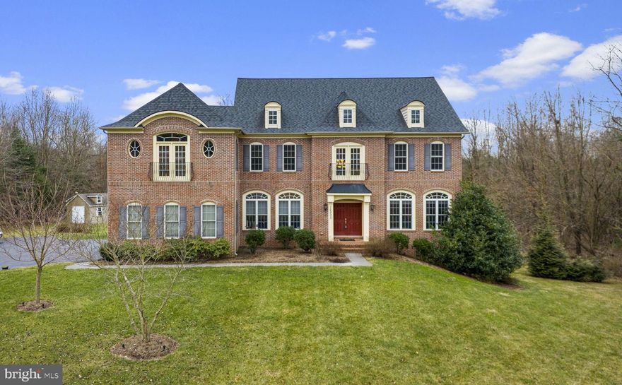 Welcome to your dream estate! This exquisite 6-bedroom detached home is a true masterpiece, nestled on over 8 acres of picturesque treelined land. From the moment you enter, you'll be captivated by the stunning features that grace the entry level.  As you step into the 2-story foyer with a curved stairwell, the grandeur of this residence unfolds. The sun-filled office, adorned with built-in shelves, offers a perfect workspace. The adjacent living room and dining room boast intricate details such as crown molding and chair rail, creating an atmosphere of timeless elegance.  The heart of this home is the gourmet eat-in kitchen, equipped with commercial-grade stainless steel appliances, including a 6-burner Viking range with double ovens, grill, and griddle. A large center island, granite & quartz counters, and a spacious pantry make this kitchen a culinary haven. The morning room and family room, with a grand stone hearth fireplace, are seamlessly connected, creating a warm and inviting space. A back stairwell leads to the upper level.  Upstairs, discover 5 bedrooms and 4 full baths, each with its own walk-in closet.  The primary bedroom is a true retreat, offering ample space, a sitting room, 2 walk-in closets, a makeup vanity, and a private ensuite bath with luxurious amenities. Two  of the additional  bedrooms feature ensuite baths, while the others are connected by a jack & jill bath. 
The lower level is an entertainment haven, featuring a large recreation room with built-in speakers, an Au Pair/In-Law Suite, a full bath, plus  utility and storage rooms. Step outside to the back patio with a grill connected to the house's main gas line—an ideal space for outdoor gatherings.  With a 3-car garage and a long driveway, parking is never an issue. The property is a secluded oasis, surrounded by 8 acres of exploration, partly bordered by forest conservation. A short walk through the back leads to Ovid Hazen Wells Recreational Park. Conveniently located near shops, restaurants, I270, and the Prime Outlet Mall, this estate offers luxury, privacy, and convenience in one unparalleled package. Don't miss the opportunity to make this extraordinary property your own!