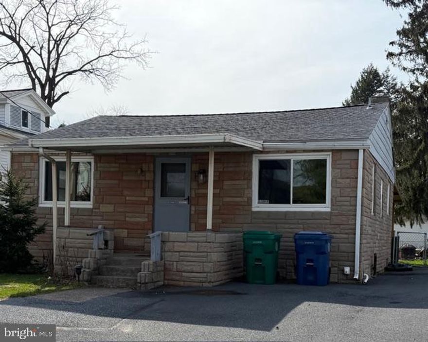 This charming 3-bedroom cottage style home, built in 1959, offers a warm and inviting atmosphere perfect for creating lasting memories.  The stone exterior and hardwood flooring add character, while the modern appliances-including refrigerator, and stacked washer/dryer ensure convenience for everyday living.  The fenced back yard is perfect for children and pets.  Nestled in a friendly neighborhood, residents enjoy easy access to local parks, perfect for leisurely strolls or weekend picnics.  The community is known for its vibrant atmosphere, with nearby shops and dining options that foster a sense of belonging.  With off-street parking and an unfinished basement, this is an opportunity to own that is cheaper than rent.  Embrace the comfort of this delightful property and the benefits of a welcoming community that truly feels like home.