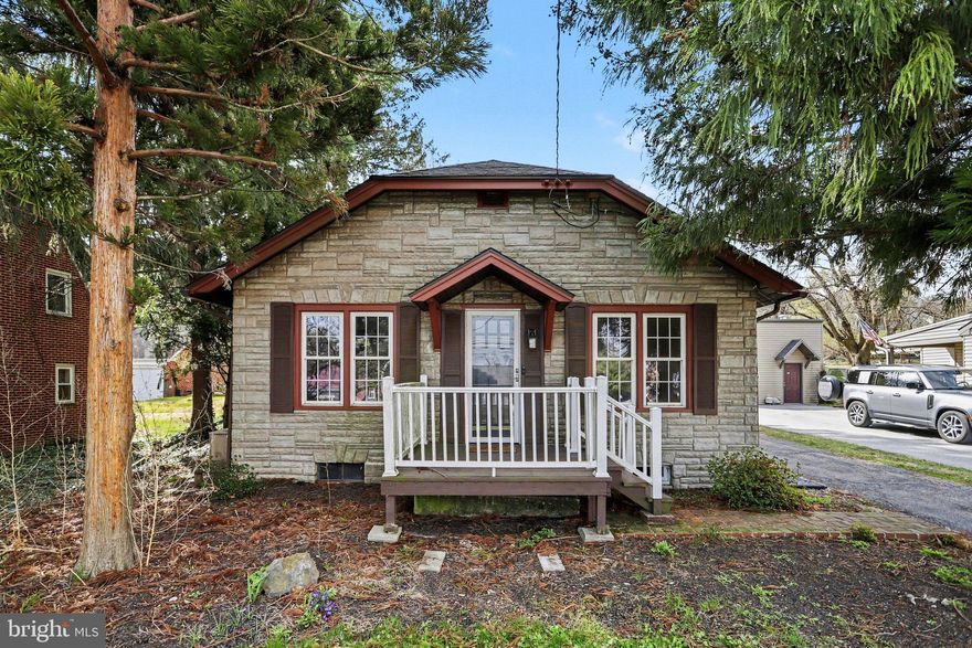 This charming 2-bedroom, 1-bath home offers a separate dining area, an updated kitchen, hardwood floors, a covered back porch, a finished basement, and a detached garage. The backyard is a peaceful escape with a tranquil pond, split rail fence, and retaining wall, making it perfect for outdoor seating and entertaining. You’ll also find plenty of storage in the basement and attic, plus an extra work area in the garage.