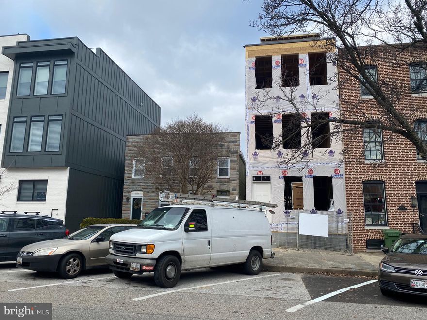 STUNNING NEW CONSTRUCTION GARAGE TOWNHOME IN A+ CANTON LOCATION - under construction by custom home builder Van Allen Homes just steps from the waterfront and Canton Square & nestled on premiere Elliott Street block this expansive 4 story home with nearly 2500 sq ft of living space features oversized 1 car garage and 1 car parking pad, main level bedroom suite and remarkable second story living space with huge living room, dining room, half bath and designer oversized island kitchen with ss appliances, 36" gas range, tile backsplash, custom cabinetry, under cabinet lighting and convenient rear deck great for entertaining!  Upper bedroom level offers two large bedrooms suites, hallway laundry and incredible owner suite with walk-in closet w/ custom built-ins, double bowl vanity, spa-like shower and massive bedroom with hallway access to 20' roof top deck w/ amazing water and city views, wet bar and half bath!  Under construction - April delivery, schedule a tour with the builder today.  Still time for buyers to customize this home, 5 year new construction/high performance tax credit available subject to dhcd approval - call for details and to ask about other opportunities - builder warranty!  See virtual tour of like finishes.