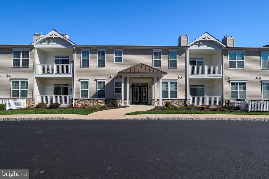 Welcome to the beautiful neighborhood of Foxfield.  Unit 1102 Poplar is very unique.  The large Dutton model sits at the end of the complex with the best views in this community.  While the unit offers beauty and serenity, the Foxfield at Naamans Creek association offers many activities for you to participate in.  Club house, tennis courts, bocci ball, golf course - so much to do.  Back inside the unit, note the secure access and beautiful lobby that leads you to your unit.  Once you enter, the hardwood floors throughout gleam, and sunshine abounds. Access to the laundry room with cabinetry and a laundry basin on the left.  Beautiful living room with room enough to include a dining table and chairs if you choose.  Kitchen has everything you could want, window to enjoy the outdoors but also granite countertops and stainless appliances.  A sitting room/sunroom to enjoy your favorite television show or read a book while enjoying the beauty of the outdoors.  Sliding doors take you to your private balcony again to enjoy the best views of the complex!  The primary bedroom is large and bright  with a large walk-in closet and large primary bath.  Second bedroom also large and bright and second bathroom just as gorgeous as the rest of the space.  From your unit you can access your personal garage either from steps just outside of your unit or from the elevator.  Makes your life so easy to pull into the garage, take the elevator right to your door.  Also, two separate storage areas only for you.  This space offers so much and is simply gorgeous.