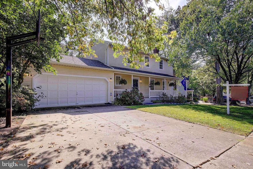 Don’t miss the chance to own this stunning home, perfectly situated in the sought-after Blackwalnut Cove neighborhood. Offering the ideal blend of privacy and convenience, this property features a backyard oasis complete with a screened porch, a spacious deck, and a beautiful built-in pool, all set on a generous 0.23-acre lot that backs up to serene, wooded views. Step inside the main level, where you'll be greeted by gleaming hardwood floors and an abundance of natural light. The sun-soaked family room, a formal dining room that can easily double as a home office, and a convenient half bathroom with a laundry area make for a versatile and inviting living space. The kitchen is a chef’s dream, boasting elegant quartz countertops, updated appliances, a pantry, and a breakfast bar. The attached dining area, with sliding glass doors leading to the deck and screened porch, creates a seamless flow for indoor-outdoor entertaining. Upstairs, the light-filled primary suite offers a private retreat with its own bathroom, while three additional spacious bedrooms and a second full bathroom complete the upper level. The fully finished lower level provides a cozy haven for relaxation, featuring a recreation room with a wood-burning fireplace and sliding glass doors that open to the backyard. This level also includes a versatile den and an additional room that is perfect as an exercise room or a fifth bedroom. The meticulously landscaped yard is equipped with an irrigation sprinkler system, beautiful hardscaping, and ample storage under the porch and deck. Recent updates include a new deck, new kitchen backsplash, kitchen cabinets painted and new hardware, new lighting throughout the house, paint and removal of popcorn ceilings, a remodeled and painted screened porch, new flooring on the upper level (2022), a gas furnace (2018), gas water heaters (2018), electric central air conditioning (2018), a gas outlet for the kitchen range (2018), and a new roof (2017). Located in the desirable Blackwalnut Cove community, this home is just minutes from downtown Annapolis, Quiet Waters Park, and an array of dining and shopping options. This property is a rare find—don’t let it slip away!