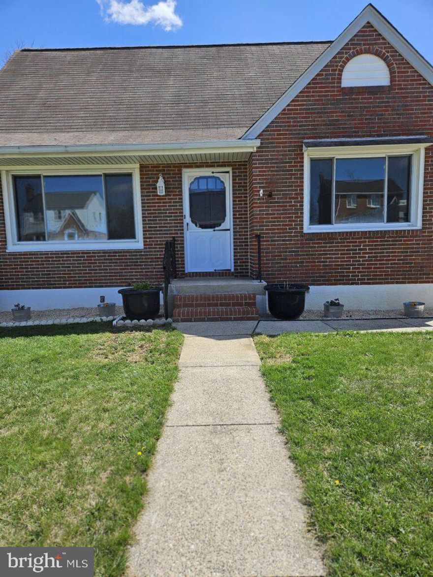 Step through the front door of this charming all brick home and be welcomed into the cozy living room, where natural light pours in thru the large bay window, highlighting the beautiful hardwood floors throughout the main level. A modern electric fireplace adds warmth and ambiance, making this the perfect spot to relax in winter months. The large screen tv over the fireplace stays with the sale. Fresh paint throughout gives the entire space a crisp, clean feel. The traditional floor plan includes a spacious dining room and eat-in kitchen with a new granite countertop, a recently replaced refrigerator, and gas stove– perfect for the home chef.  A bedroom on the main level has a nice view of the tranquil backyard, plus a full bath with updated vanity and a walk-in tub (being sold as is).
Upstairs, you'll find two additional bedrooms with ample space and another half-bath. On the lower level- there’s a finished basement with new carpeting and a corner gas fireplace on one side, plus vinyl flooring on the utility side, another half-bath, and direct access to the backyard. The backyard is a gardener’s delight, with fresh soil to plant your favorite things within the 6-foot privacy fence. Plus, a fire pit and outdoor lights for entertainment.

The detached garage is equipped with electricity, an extra refrigerator, and ample parking space in the gated driveway. There’s also a whole-house generator (being sold "as-is," needs a new battery) which adds an extra layer of peace of mind.

This home is situated in a quiet neighborhood with easy access to 95 and Baltimore City. It offers 3 bedrooms, 1 full bath, and 2 half baths, along with a ONE YEAR HOME WARRANTY, ensuring stress-free living for a full year. Don’t miss out on the opportunity to make this inviting, well-maintained home yours!