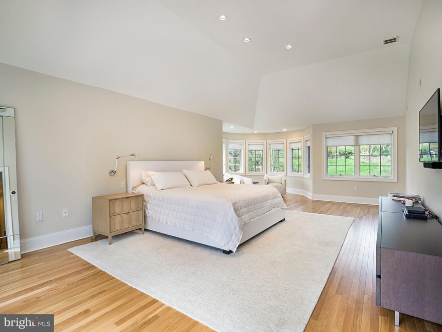 This extensively renovated custom 5 bedroom, 5 and a half bath Colonial is located on a coveted cul-de-sac in Penn Valley. The expansive residence sits on more than an acre of lush grounds with breathtaking views of the nature conservancy and backs up to the Mill Creek preserve, steps away from its  walking trails to the Mill Creek, and throughout Rolling Hill park. This lovely home blends elegant architecture and details like grand open arches, exquisite millwork and rich hardwood flooring with modern features,  luxurious amenities, and a gracious open layout.  Extensive updates includes the gourmet kitchen & living spaces to the lower-level gym, soundproofed theater & wine cellar, and new AZEK decks.  Beyond the center hall, a living room with built-in sound system & speakers sets the mood for entertainment. Host occasions in style in the spacious dining room, enjoying an open connection to the stunning kitchen with breakfast area for easy serving & mingling. The gourmet kitchen is appointed with all of the finest bells & whistles and extends to the separate bar station with 2nd Sub-Zero refrigerator/freezer. The large family room brightened by oversized windows, with scenic views & a cozy fireplace. Glass doors in the living & family rooms lead to the expansive deck for seamless indoor-outdoor entertaining. A handsome office with French doors, full laundry room & powder room also occupy the main level. Ascend the grand staircase to an open landing & 4 generously sized bedrooms (one now used as a den/media room), all with en-suite baths. The primary suite is a private sanctuary with a sitting area, deck overlooking the grounds & 2-walk-in closets. The renovated spa bath wows with radiant heated floors & towel bar, and enormous glass-enclosed shower. A walk-up attic is ideal for storage. The lower level, with separate entrance and dual staircase to the main level, is an incredible recreation space with something for everyone, including a home theater, gym and 4-person sauna.  It is complete with a 1000 bottle dual climate controlled custom wine cellar.  Positioned on this level, an additional bedroom has large closets, a nearby full bath.  An improved oversized 3-car attached garage is heated on demand. This location offers the ultimate convenience with Lower Merion schools, local amenities, all major transportation routes, and Center City just 12 minutes away!