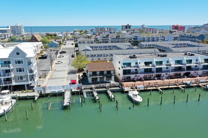 RARE WATERFRONT OPPORTUNITY WITH ENDLESS POTENTIAL! NEWER VYNIL BULKHEAD! 
This is truly a one-of-a-kind waterfront property nestled on an oversized 6,000 sq ft lot overlooking the protected cove of Harbor Island. Opportunities like this are incredibly rare—offering not only location, but unmatched versatility and potential.
The existing over 2,000 sq ft two-story home invites you to bring your vision to life. Whether you choose to renovate and customize the current residence or explore the potential to build two units (with town approval)—living in one and renting the other—the possibilities here are exceptional.
Boating enthusiasts will appreciate the 3 private boat slips, including one with an electric lift, along with over 40 feet of water frontage complete with water and electric at the dock. Enjoy direct access to open water while being tucked into a calm, protected cove—perfect for boating, fishing, or simply relaxing by the water.
Enjoy gorgeous nightly sunsets while entertaining family and friends on your large private deck after a day on the water. Prefer the beach? You’re just a short walk away from putting your toes in the sand.
This location is truly a WATERMAN'S DREAM, offering endless opportunities for fishing, boating, swimming, and even front-row seats from your own deck to watch the excitement of the annual White Marlin Tournament, including the boats returning, weigh-ins, and all the energy this iconic event brings.
Skip the beach traffic altogether—just hop on your boat and cruise to the many waterfront restaurants and bars along the Ocean City bayfront for dining, drinks, and entertainment.
Why pay condo or HOA fees when you can own your very own piece of waterfront paradise? This property offers the freedom, space, and flexibility that’s hard to find in today’s market.
This home is being sold “As Is”, presenting a rare opportunity to secure a premier waterfront location and make it your own.
The world is your oyster with this Harbor Island gem—don’t miss an opportunity like this again!