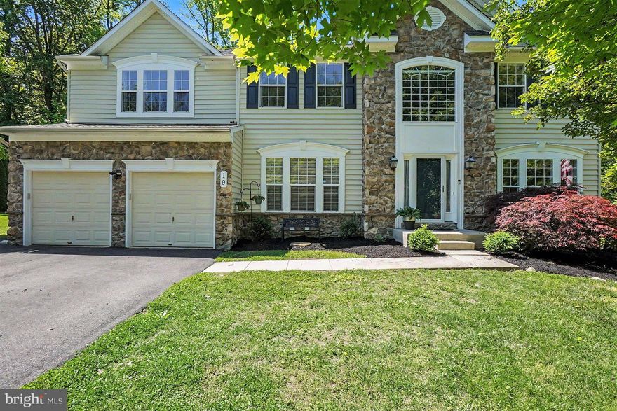 Welcome home to 19 Crescent Links Dr, located in the sought-after Chesapeake Club–Fairway Villages community. This beautifully maintained Richmond American Berkshire V model offers over 3,500 sq ft of above-grade living space, enhanced by thoughtful bump-outs and stylish upgrades throughout.
A grand two-story foyer with wood laminate flooring and elegant columns sets the tone, flanked by formal living and dining rooms—perfect for both everyday living and special gatherings. A private office or library/den with French doors provides an ideal work-from-home space.  The open-concept layout continues with a gourmet kitchen featuring an expansive granite island, built-in cooktop, stainless steel appliances, and beautiful 42” high cabinetry. The adjoining breakfast area opens to a spacious deck overlooking a semi-private, wooded setting—perfect for relaxing or entertaining. The inviting family room offers a cozy gas fireplace with mantle, while the main level also includes convenient washer/dryer hookups for added flexibility.  Upstairs, the spacious owner’s suite features a sitting area, walk-in closet, an en-suite bath with soaking tub and separate shower, along with the option for upper-level laundry. Three additional bedrooms and a full bath complete the upper level.  The unfinished walkout basement provides abundant natural light, a rough-in for a full bath, and endless potential for future living space, storage, or a workshop.  Recent updates include fresh paint, new carpet, a new roof, and two new HVAC systems (2025). Additional highlights include crown molding, chair rail and shadow box trim, updated lighting, central vacuum, owned propane tank, a whole house water filtering system and a high-flow sump pump with battery backup.  Ideally located just minutes from I-95, downtown North East, marinas, parks, and Elk Neck State Forest, this home offers the perfect blend of comfort, convenience, and community charm.