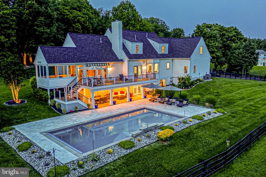 Thank you for all the showings and offers! 
Experience the epitome of luxury living in Paradise! Nestled on 10 acres of picturesque land, this stunning remodeled Cape Cod home offers breathtaking mountain and pastoral views that will leave you in awe. Indulge in the serenity of this private retreat, where you can witness magnificent sunsets that paint the sky in vibrant colors every evening. Plus, you'll have the added convenience of FIOS, ensuring seamless connectivity in this idyllic setting. Conveniently located just 5 minutes from downtown Leesburg, this property strikes the perfect balance between accessibility & tranquility. Embrace the peace and quiet of your surroundings while being within easy reach of local shopping, restaurants, schools, healthcare, and more. With its ideal in-and-out location, you'll have effortless access to major routes such as the Greenway, as well as routes 7 and 15, making your daily commute a breeze. Prepare to be captivated by the recent upgrades and meticulous attention to detail found throughout this remarkable home. Spanning over 4600 square feet across three levels, this residence offers an abundance of space for both relaxation and entertainment. Step onto the charming front porch, a welcoming spot to unwind and enjoy the fresh air. As you enter, you'll be greeted by the formal living and dining rooms, adorned with large windows that flood the space with natural light. The exquisite trim details & new light fixtures add a touch of elegance to these refined spaces. Indulge your culinary aspirations in the fully remodeled kitchen, a true masterpiece. The new white Shaker cabinetry, soft-close drawers and doors, and stunning waterfall granite countertops create an ambiance of sophistication. Equipped with top-of-the-line stainless-steel appliances, this kitchen is a haven for any aspiring chef. The main level boasts newly refinished hardwood floors in a rich finish, complemented by new iron balusters on the staircases, fresh paint throughout, & exquisite trim details. With sweeping countryside views gracing the entire rear of the home, every day will feel like a retreat into nature's embrace.
The family room features a new stacked stone fireplace with a mantle, offering warmth and comfort while showcasing the beauty of natural elements. With its expansive windows, this space seamlessly connects to the kitchen and casual dining area, creating an open concept feel that is perfect for entertaining. The primary suite, also located on this level, exudes luxury and tranquility. Custom trim details, a spacious custom closet, and an upscale bath with new granite countertops, a walk-in shower, double vanities, new lighting, & custom mirrors provide the ultimate sanctuary. Step onto the screened-in porch just off the bedroom and access the new Composite deck, both offering breathtaking views that will leave you mesmerized. Whether you're starting your day or winding down, this is the perfect spot to soak in the majestic beauty of your surroundings. And don't forget the incredible stargazing opportunities this property presents! Upstairs, you'll find two additional bedrooms adorned with new light fixtures, each boasting its own upgraded full bath with new marble countertops, lighting, and custom mirrors. Additionally, a finished room above the garage offers flexible space and features a new large window that frames stunning views. With a rear staircase leading to the 3-car garage, this room can serve as a home office or an extra bedroom, catering to your specific needs. The lower level of this home is truly a haven of versatility. Boasting new Luxury vinyl-plank floors throughout, this level can function as an in-law suite or an extended stay for guests. Full-size windows & French door access to the rear patio and new pool with Travertine surround ensure that you can enjoy the outdoors regardless of the weather.