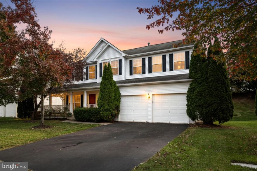 Welcome home to this beautiful 4-bedroom, 3.5-bath residence in highly desirable Evergreen Meadows, just minutes from historic downtown Leesburg and convenient to all major commuter routes.  Enjoy exceptional outdoor living with an inviting wrap-around front porch, a spacious flagstone patio, and a fully fenced backyard—perfect for relaxing or entertaining.  Inside, you’ll find wide-plank hardwood floors throughout the main level and an open Princeton II floor plan by Richmond American Homes, designed for modern living. The chef’s kitchen features granite countertops, stainless-steel appliances, and a gas cooktop, opening seamlessly to a large family room with built-in cabinetry and a cozy gas fireplace. A main-level office with a closet provides flexibility as a guest bedroom.  Upstairs, the luxurious primary suite includes a tray ceiling, sitting area, and walk-in closet, accompanied by three additional bedrooms and a shared hall bath.  The finished lower level offers even more space with a recreation room, full bath, laundry area, and a versatile den or workout room, along with generous storage.  Recent updates include: HVAC system and radon mitigation (2018) and a new water heater (2020).  This Evergreen Meadows gem combines timeless design, comfort, and unbeatable location—a true Leesburg favorite!