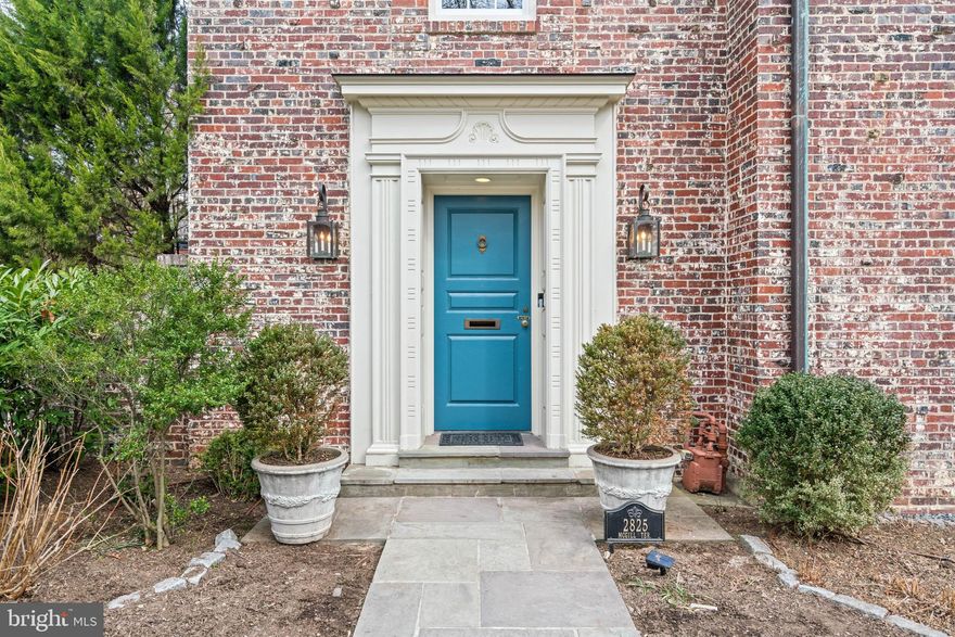 Ideally located on a coveted tree-lined street in the prestigious Massachusetts Avenue Heights neighborhood, this elegant 1929 residence masterfully blends historic character with modern connivence.  The 5-bedroom home has undergone a renovation, preserving its timeless appeal while introducing updated finishes and attention to detail across the four floors. The appealing brick façade sets the tone for the refined interiors, where classic design elements merge with luxurious updates. Upon entering, you are greeted by a welcoming foyer that flows effortlessly into the spacious living room, featuring a fireplace and bay windows that flood the room with natural light. Adjacent to the living room is a bright sunroom, surrounded by French doors and high ceilings, which opens to a private rear terrace. The sunroom flows into the formal dining room featuring custom millwork and an elegant atmosphere enhanced by additional large bay windows. The gourmet kitchen is equipped with high end appliances, two sinks, granite countertops, and a generous pantry. A convenient mudroom, located off the side entry, adds functionality and provides easy access to the attached two-car garage. 
The second floor offers an expansive primary suite, with an adjoining sitting room. The luxurious primary bathroom offers dual vanities, a spacious soaking tub, and a frameless glass shower. The suite is complete with an additional half bathroom, a spacious walk-in closet, and the added luxury of a private balcony. The further two generously sized bedrooms on this floor are filled with natural light, offer ample closet space, and share a beautifully appointed hall bathroom.
The third floor features two additional bedrooms, a generous landing for a sitting area, a full bathroom, and a cedar closet. The lower level offers an attractive media room with custom built-in shelves, a half bathroom, laundry room, and abundant storage space, with the added benefit of a private outside entrance. The exterior of this home exudes beauty and tranquility, with lush, manicured landscaping, multiple patios, and mature trees that create an inviting sense of privacy. A gated two-car garage offers secure parking, with two additional surface spots. The home is sited on a coveted, quiet street, and is within a short stroll of esteemed schools, neighborhood parks, Metro, and trails to Georgetown, Dupont, and the Washington National Cathedral.