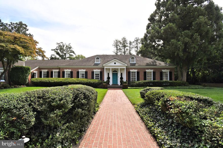 Welcome to 951 Frazier Road, a one-of-a-kind custom brick estate nestled in the heart of Rydal. With over 6,000 square feet of refined living space, this architecturally distinctive Cape Cod-style residence offers expansive interiors designed for comfort, entertaining, and timeless elegance.
Step into a grand marble foyer that sets the tone for the home’s sophisticated interior. The living room features floor-to-ceiling windows, parquet hardwood flooring, recessed lighting, and a gas fireplace with a stone surround and custom mantel—perfect for cozy evenings or stylish gatherings. Adjacent, the richly appointed den/study showcases paneled wood walls, wide-planked floors, a second gas fireplace, wet bar with wine cooler, and a dedicated wine closet.
The kitchen is more than a culinary workspace—it’s a serene, thoughtfully designed environment that invites calm and creativity. Exposed beams, white wood cabinetry, quartz countertops and backsplash create a warm, organic feel. Premium stainless steel appliances include a double wall oven, gas cooktop with hood, built-in refrigerator, and dishwasher. A massive center island anchors the space, while the cathedral-ceiling breakfast area—with wood-burning fireplace and custom indoor grill—adds rustic charm. Additionally, there is a 5 stage reverse osmosis water filtration system (kitchen only). Just off the kitchen, a spacious pantry and laundry room offer abundant storage, granite surfaces, and modern appliances.
The formal dining room is a showstopper, with floor-to-ceiling windows, custom upholstered walls, hardwood flooring, and another wood-burning fireplace—plus serene views of the beautifully landscaped garden area, making it ideal for elegant dinners and seasonal entertaining.
The main level also features two stylish powder rooms (main hallway and foyer).
The first-floor primary suite is a private retreat, complete with custom closets, a separate dressing room, and a spa-like bath featuring marble floors, a jacuzzi tub, stall shower, makeup vanity, and exquisite woodwork with mother-of-pearl inlay. Two additional en-suite bedrooms on the main level offer comfort and privacy for family or guests.
Upstairs, a fourth bedroom, full bath, media room, and storage areas provide flexible space for guests, in-laws, or a nanny suite. The second-floor bath includes granite counters, ceramic tile finishes, and a set-in tub with sliding glass enclosure.
The partially finished basement expands your living space with a full bar, exercise area, recreation room, and ample storage. Mechanical upgrades include five-zone heating and central air, upgraded electrical systems (200 AMP), Bradford White hot water heater, and a backup generator.
Outside, enjoy a private, landscaped yard with an in-ground pool, rear patio, and a newly constructed oversized two-car detached garage featuring corrugated metal siding, poured concrete floors, built-in shelving, and overhead storage racks.
This exceptional property blends craftsmanship, comfort, and convenience in one of Rydal’s most desirable neighborhoods. A must-see for the discerning buyer seeking space, style, and substance. Schedule your appointment today!