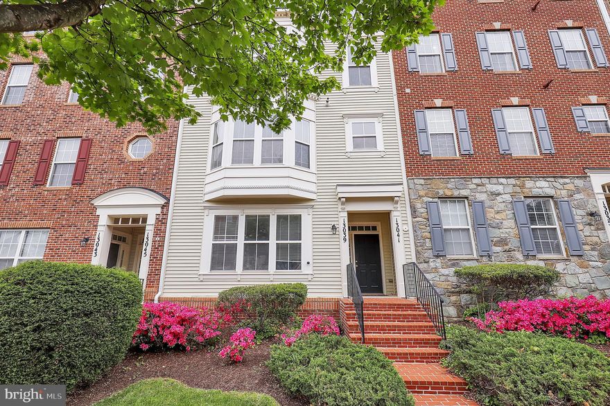Welcome to 13039 Clarksburg Square Rd, a bright and beautifully maintained 3-bedroom, 2.5-bath 2-over-2 townhome-style condo located in the heart of the highly desirable, amenity-rich Clarksburg Town Center. This two-level home offers the convenience of a private first-floor entrance and attached garage, paired with an open, sun-filled layout designed for comfortable everyday living.

The updated kitchen features refreshed cabinetry and newer appliances—including a refrigerator, stove, and dishwasher (approximately 4 years old)—while the bathrooms have been tastefully improved with updated vanities and countertops. Major system updates include an HVAC system replaced in 2022 and a roof approximately 3 years old, maintained by the HOA for added peace of mind.

Upstairs, flexible living space includes a bedroom or ideal home office with access to a private deck—perfect for morning coffee or a quiet retreat. Large windows throughout the home bring in abundant natural light, enhancing the warm and inviting feel.

Clarksburg Town Center is a thoughtfully designed, master-planned community known for its exceptional lifestyle amenities, including a clubhouse, outdoor pool, fitness center, tennis courts, scenic walking and jogging trails, parks, and community gathering spaces. Residents enjoy a connected neighborhood feel with easy access to nearby shopping, dining, and entertainment, as well as convenient proximity to I-270 and Route 355 for an ideal commuter location.

Offering the perfect blend of low-maintenance living, modern updates, and vibrant community amenities, this home is an exceptional opportunity in one of Clarksburg's most sought-after neighborhoods.