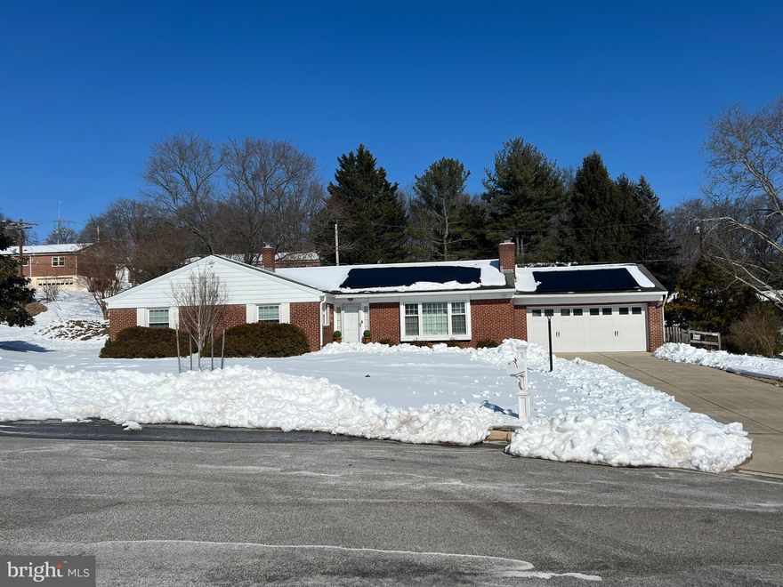 Welcome to This Beautiful Brick Rancher with All 4 BR's on the Main Level & 3 Full Baths with Wonderful Energy- Saving  'Seller Purchased' Solar Panels & a 2 Car Garage!- The LG Entry Foyer Leads to a Very Spacious & Sunny Living Room with a WB Fireplace, Recessed Lights  & Built-in's That Leads to a Generously Sized Dining Room (Both with Hardwood Floors)-The Gourmet Granite Island Kitchen has White Wood Cabinets & Opens to a 1st Floor 3 Season Sunroom/Family Room-This Room Includes Space Heaters if One Wants to Use it Year Round-The Sunroom Has a Closed Off Non-functioning Fireplace That is Located Behind the Glass Front Hutch Cabinet & is Closed Off & Conveys AS-IS- All 4 BR's on the Main Level Have Hardwood Floors as Well & More Recessed Lights! The Lovely Primary Bedroom has a Beautifully Updated Primary Bathroom That includes a Separate Over-sized Tub- This House Also has an Exceptionally LG LL with a Perfect Space for An In-Law or Au Pair Suite Which Includes a Kitchen & Nice Full Bathroom + An Walk-up exit to it its Own Fenced Yard Area-This Same Space Can Also Offer Great Space for Entertaining, Hobbies , a 4th BR or an Office-Do Not Miss the Wonderful Dry & Nicely Lit Crawl Space-Nice Replacement Windows-The Gas Heat Furnace /CAC has Been Nicely Maintained-Roof Believed to Be  18-20 Years Old & Was Inspected to Be in Good Condition 2024-The Half Acre Lot has a Fenced Rear Yard & a Inviting Patio for Outdoor Entertaining! Show & Sell! (The 2 Kitchen Stools Are Excluded)