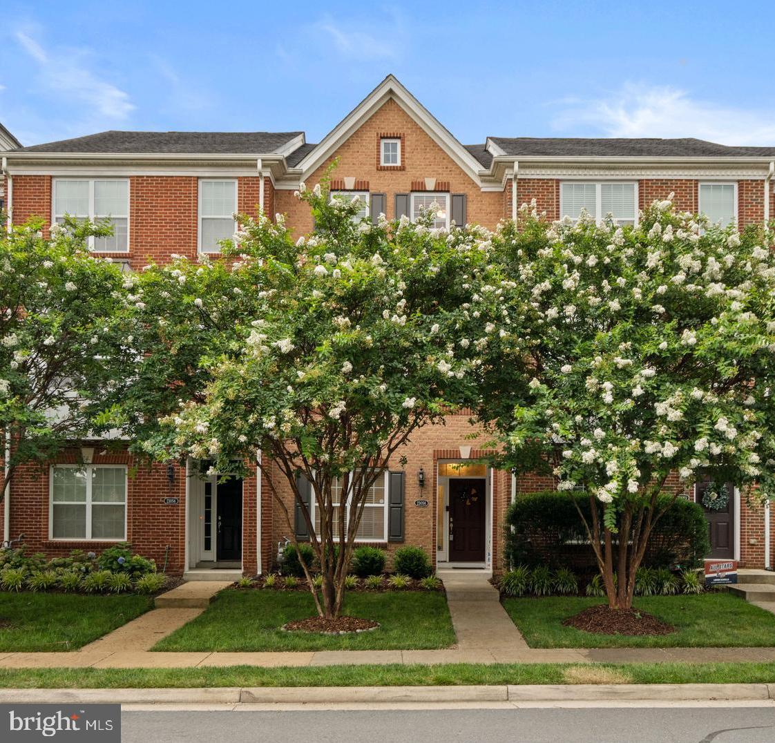 Welcome home to this beautiful Ashburn townhome on a premium lot backing to woods with great Loudoun public schools! This unit has been well-maintained by the owners, and numerous updates and upgrades have been made. The main level features an open floor plan with an abundance of natural light and a spacious gourmet kitchen equipped with stainless steel appliances, a large center island, and ample cabinetry, as well as an eat-in space. The main level family room features the original hardwoods beneath the carpet, which the new owners can uncover if desired. The deck also features a motorized Sunsetter awning to keep you in the shade on those hot summer days, allowing you to enjoy the peaceful setting and privacy of this wood-backed, premium lot. The kitchen flows seamlessly into a living/dining room area, offering plenty of options for a homebuyer to tailor the space to their needs. The half bath on the main floor was also renovated in 2025. Upstairs there are 3 bedrooms with vaulted ceilings, and 2 full bathrooms, including custom closet built-ins and a double vanity in the primary suite (newly painted in 2023). In addition to the two other bedrooms and full bathroom, there is also upstairs laundry with a new washer in 2024. Downstairs is a fourth true bedroom with its own closet and full bathroom, which is a huge bonus for guest space or a great home office. The garage also has TONS of built-in storage shelves. Upgrades include a new water heater (installed in 2024), a new HVAC system (installed in 2022 with a transferable warranty through March 2027), new carpet and flooring in 2021/2022, a motorized Sunsetter deck awning in 2021, and updated light fixtures. The street behind the townhome is a dead-end and a great place for playing with young kids on a quiet street. Through the Loudoun Valley Estates II HOA, you also will have access to three separate pool complexes (one is a short walk away), fitness center, several playgrounds, and walking trails. Close to the Ashburn Metro (3 miles), major commuting routes, Hal and Bernie Regional Park, wineries, and shopping. Come check this house out for yourself!