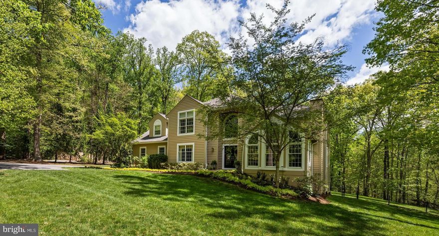 Beautifully constructed custom Colonial set on 3 private acres, offering space, elegance, and thoughtful design throughout. A grand two-story foyer welcomes you, flanked by traditional living and dining rooms filled with abundant natural light. The family room features soaring vaulted ceilings, propane stove  and walls of  built-ins, creating a warm and inviting gathering space. The newly renovated kitchen is a chef’s dream, complete with a center island, stainless steel appliances, family dining space and Butler's bar, perfect for entertaining. A private office with pocket doors is conveniently located off the family room—perfect for working from home. The main level also includes , a powder room for guests and mudroom/laundry with ample storage and access to the side-loading over sized two-car garage. Upstairs, the spacious primary suite offers custom built-ins, walk -in closet and a luxurious en-suite bath. The second bedroom includes its own en-suite bath, while the third and fourth bedrooms share a bathroom. The fully finished lower level is designed for both relaxation and entertainment, with multiple areas for watching TV, playing ping-pong or pool, plus an exercise room, additional bedroom, full bath, and generous storage closet. Walk out to the expansive backyard, complete with a large deck off the kitchen, beautiful landscaping, and a fully fenced yard for added privacy. This private, gated property has been meticulously maintained and offers the perfect blend of comfort, style, and functionality.