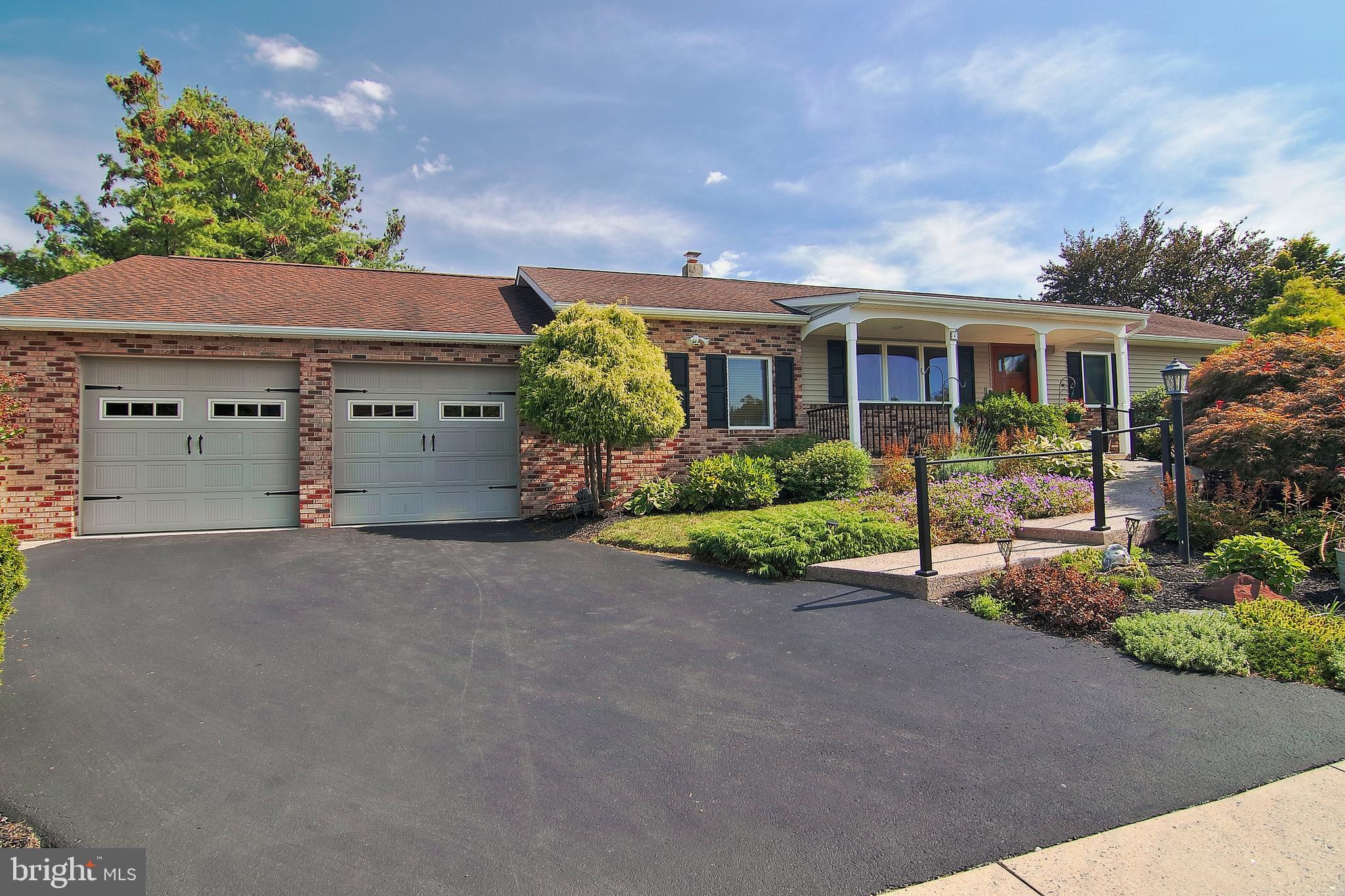 Much more than meets the eye! Welcome to this beautifully updated home in the highly sought-after Presidential Estates neighborhood. This admired corner property is full of quality upgrades and timeless charm. From the moment you arrive, the professional landscaping and hardscaping set the tone, leading you to the welcoming front porch and a striking custom front door. Once inside, you will appreciate the open floor plan. The dining room flows seamlessly into the heart of the home, the brand new custom kitchen, sure to be the envy of your family and friends. Here, a vaulted tongue-and-groove ceiling with recessed lighting and a ceiling fan draw the eye upward. White shaker cabinets by local craftsman with soft-close features are perfectly contrasted with a deep blue island, topped with pendant lighting crafted by local glass artist Taylor Backus. A chef’s dream, the upgraded stainless appliances include a 48" Thermador gas range, Thermador dishwasher and Bosch refrigerator. Just beyond the kitchen is the sunken living room, designed to feel like a mountain lodge with its wood floors, barn wood accents, and striking stone wall with a gas/propane stove—flanked by built-in storage and stairs. Down the hall, you’ll find three bedrooms and an updated full bath, including a primary suite with double closets and a private, modernized bathroom. The finished basement expands your living space with a large family room featuring a wood/coal stove (with additional propane option), a versatile bonus room (perfect for an office or fourth bedroom), and two storage areas, including one with convenient Bilco access. Quality upgrades include new Anderson windows, whole house Generac generator, 2 car added garage with second floor walk up storage and engineered hardwood flooring. Out back, enjoy a private covered patio and 6 person hot tub—perfect for crisp fall evenings. With its prime location, this home offers walkability to the community park and all three schools. Lovingly maintained by the same owners for over 30 years, it’s now ready for its next chapter. Could this be your forever home? Agent is related to sellers.