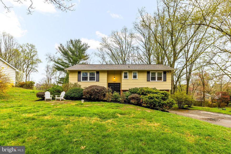 OPEN HOUSE CANCELLED! Welcome to 1205 Mill Creek Road — a charming retreat nestled on a peaceful street in the highly sought-after Village of Carrs Mill neighborhood in Fallston. This beautifully maintained home sits on over half an acre of private land, offering a serene, tree-lined backdrop. With ample space for gardening, outdoor entertaining, and peaceful relaxation, the possibilities are endless.

The main level features an open-concept kitchen, living, and dining area, ideal for modern living. The heart of the home is the expansive family room addition, boasting soaring cathedral ceilings and an abundance of natural light from large windows that create a bright and welcoming atmosphere. The family room flows seamlessly to the oversized Trex/vinyl deck, offering breathtaking views of the surrounding property—perfect for unwinding or entertaining guests.

The kitchen is both functional and stylish, with plenty of counter space for prepping meals, abundant cabinetry for storage, and a design that enhances the home’s airy, open feel. Down the hall, you'll find three lovely bedrooms, including a primary suite with a private half-bath en suite. The additional bedrooms are bright and share a full hall bathroom with a tub/shower combination.

The lower level offers even more space to spread out, featuring not one, but two large recreation rooms, ideal for playrooms, home theaters, or a home office. Additionally, the lower level boasts a wet bar complete with a wine fridge, perfect for entertaining or relaxing. You'll also find a fourth bedroom, a full bathroom (with a private entrance for added convenience), and a laundry room. The drop zone/mudroom provides extra functionality, and there’s no shortage of closet and storage space. The basement opens to a private patio beneath the deck, where you can enjoy a cozy outdoor experience—even in rainy weather. For ultimate relaxation, unwind in the hot tub, adding an extra touch of luxury to your private retreat.

Recent updates enhance the home's appeal, including fresh paint (2022), brand-new carpet (2022), refinished hardwood floors (2022), and newer appliances. Major improvements include new windows (2020), a new roof with 50-year architectural shingles (2021), Leaf Guard gutter guards (2016), new 200-amp electrical panel (2021), a new heat pump for dual-zone HVAC (2018), and a new washer and dryer (2020). Plus, the hot water heater was replaced in 2019, providing peace of mind for years to come.

With its fantastic location, spacious design, and thoughtful updates, this home offers an exceptional opportunity. Schedule your tour today and see all the wonderful features this property has to offer!