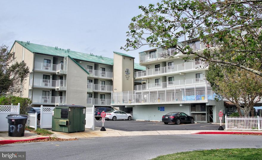 DIRECT BAY FRONT CONDO W/ DEEDED BOAT SLIP & TWO CAR PARKING - located at the end of 94th Street this bi-level condo offers unobstructed bay views from two large balconies, elevator service throughout the building and large community pool!   The condo features two bedroom suites on two separate levels, open floor plan with lofted ceilings, tile flooring throughout common areas, carpet bedrooms and galley kitchen.  Recent updates include new sliding glass doors and a/c compressor, deeded boat slip #10.