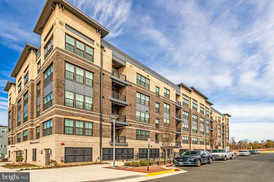 FULLY ASSUMABLE VA LOAN AT 4.375% ...APPROX LOAN BALANCE $586,000,   
GORGEOUS BRIGHT & SUNNY TOP FLOOR CORNER UNIT "AVA" MODEL"... 2 BEDROOMS, 2 BATHS BARELY LIVED IN & IN LIKE NEW CONDITION...GARAGE PARKING...UPGRADED KITCHEN AID APPLIANCES, SPACIOUS KITCHEN WITH HUGE CENTRE ISLE, QUARTZ COUNTERT0PS,  PANTRY...WOOD FLOORS IN MAIN LIVING AREA...WALK IN CLOSET IN PRIMARY BEDROOM, PRIMARY BATH WITH DOUBLE SINK VANITY AND WALK IN SHOWER... CUSTOM SHADES THROUGHOUT w/BLACKOUT SHADES IN PRIMARY...LAUNDRY ROOM WITH FULL SIZE WASHER & DRYER IN UNIT...STORAGE SPACE/ROOM ON BALCONY...
Walking distancee to to Metro, Innovation Center Station, Silver line.  A Well Landscaped Community with Path Lighting, Arches and Benches. Arrowbrook Park with Soccer Field, Basketball Court, Tot Lot, Tennis Courts, and Dog Park is Only 1 Block Away. A Well Lit Dedicated Path to the Metro. The Metro is about a 12 Minute Stroll Away when Using the Dedicated Path. The Path Also Leads to Downtown Herndon. Clock Tower Shopping Center with Restaurants and Retail is just over Half of a Mile away. Also Near the Upcoming Rivana Development that will include Restaurants, Retail, an Entertainment Center, and Parks.