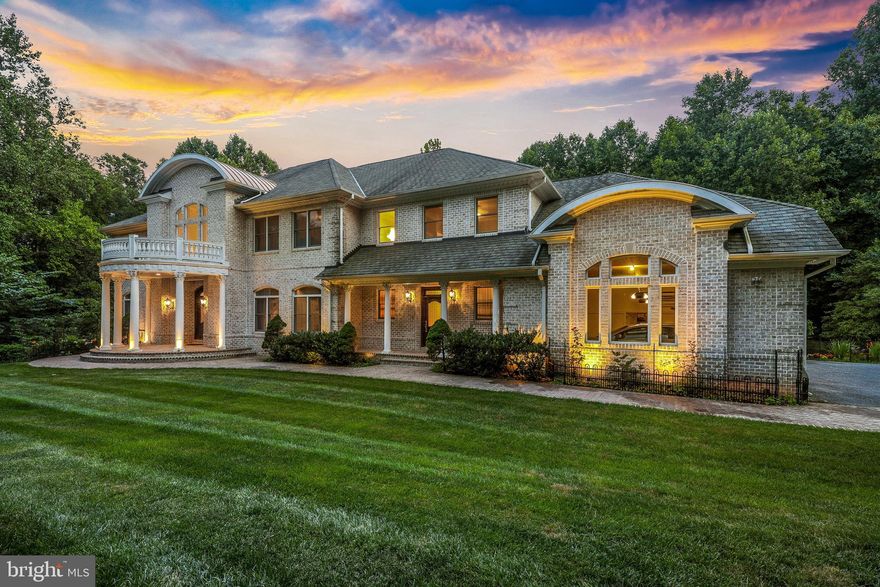 An exceptional 10,072 sqft custom design with Mediterranean architectural influences and varying rooflines creating a functional yet elegant lifestyle sited on a landscaped 1.82 acre homesite in a quiet cul-de-sac setting in Forest Glen. A grand marble foyer displaying a dome ceiling with an imported chandelier with a motorized lift system and a waterfall staircase grants a glimpse into a well laid-out residence ideal for entertaining and casual daily living. This one-of-a-kind home offers exquisite trim and custom moldings with intricate detail, arched doorways, hand crafted finishes, gorgeous hardwoods, Corinthian columns, a casual rear staircase to the bedroom level, and multi zone heating and air conditioning. Exteriors feature a full brick construction, large wooden front doors with lead glass windows, a sprinkler system, landscaped and hardscaped grounds with custom professional lighting, a low maintenance composite wrap-around deck with a hexagon extension overlooking the tree-lined yard, and a veranda style brick patio. Upon entering, you are welcomed into this sun drenched home showcasing dynamic elements throughout including a generously sized formal living room, a celebratory formal dining room, a main level ensuite bedroom, and French doors opening to a private study. Voluminous two-story great room features a central raised hearth fireplace with a detailed mantel and mirrored mosaic over mantel drawing your attention to the beautiful crown moldings and chandelier. Stylishly outfitted gourmet kitchen is highlighted by granite counters, plentiful raised panel wood cabinetry, top-of-the-line stainless appliances including a GE Monogram refrigerator and freezer, Fisher and Paykel dishwasher, and a Dacor 6-burner gas range wrapped around a center island with prep sink and a Thermador professional upper exhaust, and a bay wall where you can choose to dine informally inside a light-filled breakfast room with a walkout to ideal al fresco dining on a low maintenance tiered deck with Python balusters. Owner's suite presents a beautifully trimmed tray ceiling, a sitting area, a large bay window, a see-through fireplace, two walk-in closets, and an luxury bath complete with dual vanities separated by a dressing table, a step-in shower with bench seating, and a center platform jetted tub overlooking a linear fireplace shared with the bedroom. Lower level hosts a rec room with a fireplace, full custom wet bar, a gathering room, a game room, an open billiard room, a theater room including a projector and large screen, a bedroom with a walk-in closet and full bath, a sauna that seats 6, an exercise room with special flooring, and atrium door walkouts to a brick lanai. The artistry of exceptional craftsmanship is evident in the design and function in this sought-after home!