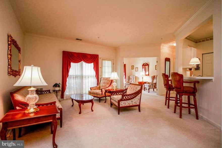 Bright & sunny first floor unit that has been meticulously maintained! Features an open floor plan with spacious living/dining room that opens through French doors to sitting room & out to cozy patio. Two large bedrooms each with own attached bathroom, & walk-in closet & dual vanity sinks in master suite. New furnace & AC unit in 2012 w/ 10yr warranty!