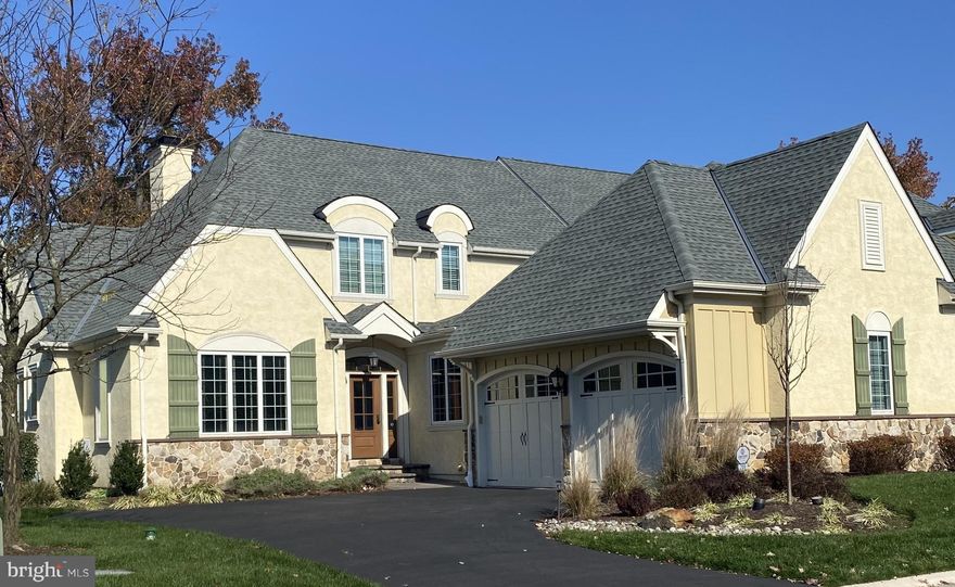 If you enjoy natural light glistening through your main living space, you should check out this cheerful, luxury home in the Haverford Reserve.  This stunning “Hudson” model has a very smart floor plan that maximizes the use of the space and delivers nearly 4,000 sq ft of finished living space.  The gourmet Kitchen flows into a vaulted Great Room and out to a private patio and flat backyard. The Kitchen and Dining Room enjoy a lovely Butler’s Pantry in between. The home has a neutral palette, so you can easily make design choices to allow your personality to shine through.  Although, it is so gorgeous that you might not want to change a thing!
With the Main Bedroom suite and handsome Home Office on the first floor, you can enjoy single level living when desired and expand into the additional bedrooms, both upstairs and in the Lower Level when you have friends and family with you.  In addition to a Bedroom and full Bathroom, the Lower level has a cool movie (or game day) room, a home gym and plenty of storage.
Additional features that you will appreciate in this lovingly well-maintained home are a full house generator and designer fixtures and finishes throughout.
The Haverford Reserve is a community of 100 luxury carriage homes located in the heart of the Main Line amidst 124 acres of preserved land, walking and bike trails.  There is easy access to Philadelphia and New York City via highway or train.