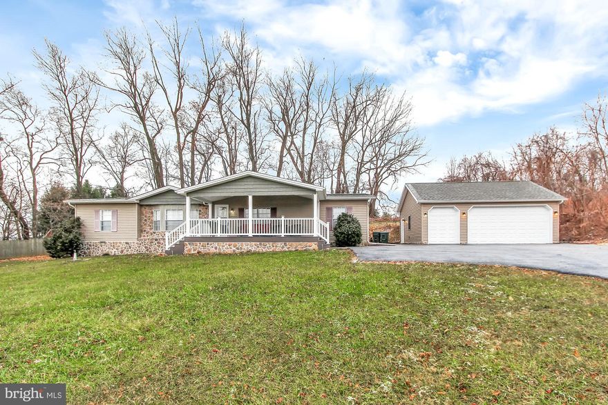 This cute as a button rancher has all the desirable one-story amenities everyone is searching for with abundant space and privacy. The cozy fireplace with stone surround in the vaulted family room flows nicely between the dining room and bright, open kitchen with skylight, double oven, island and so much more.  Large master bedroom retreat with adjoining spa-like bath is a relaxing getaway at the end of a busy day. Decks back to a lovely treeline and the large additional side yard with pool is a great bonus. Home boasts open layout,  front sittin' porch w/ceiling fan, detached 2-1/2 space garage, enlarged and repaved driveway, updated kitchen, new furnace and  40-year architectural shingle roof! This charmer is move in ready and tucked back away from the hustle and bustle. Start the new year off right by making this home YOUR home.