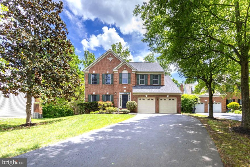 Welcome to this stately brick-front colonial nestled in Oak Hill’s sought-after Monroe Manor community, ideally situated at the end of a quiet cul-de-sac. Spanning nearly 4,000 square feet across three finished levels, this meticulously maintained home offers 4 spacious bedrooms and 3.5 bathrooms, providing both comfort and functionality. Flooded with natural light, seller’s favorite feature is how bright and cheerful the home feels year around. Step into the elegant two-story foyer with gleaming hardwood floors that flow throughout the main level. The desirable layout features formal living and dining rooms, perfect for entertaining, along with a gourmet kitchen equipped with a center island and cooktop, double ovens, and stainless steel refrigerator. Adjacent to the kitchen, the expansive family room boasts a cozy gas fireplace for family gatherings. On upper level,  you’ll find four generously sized bedrooms with luxury vinyl plank flooring throughout. The primary suite includes a walk-in closet and a spa-like bathroom with a large soaking tub and separate walk-in shower. The finished lower level offers a massive recreation room, a dedicated office, and a full bathroom—ideal for guests or working from home. Recent updates include: New roof (2024), HVAC (2018),Garage door (2021), Hardwood floors on main level (2018), LVP flooring on upper and lower levels (2023), Powder room (2025),Updated vanities, mirrors, and lighting in the primary and hallway bathrooms (2025). This house is conveniently located near Dulles International Airport, metro and bus stops, and major commuter routes including Fairfax County Parkway, the Dulles Toll Road, and Route 28. Zoned for top-rated schools: Floris Elementary, Carson Middle, and South Lakes High School. This home is also just minutes away from one of the area’s most prestigious private school, Nysmith School for the Gifted. Open House Saturday May 9th 1-3pm