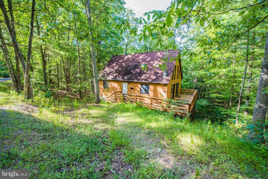 Enjoy all the seasons in this updated chalet in Bryce Resort!  *Open and airy great room with vaulted ceilings, beams, wood floors, tall windows and corner stone hearth  *Stainless Steel Appliances  *Ceramic Tile Baths  *Vaulted Master Bedroom  *Wooded setting near end of cul-de-sac  *Wrap around deck  *New Carpet  *Little to no lawn maintenance  *Tranquil setting moments from skiing, tennis, lake