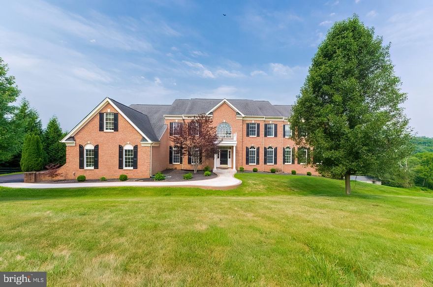 WOW!! Over 9000 square feet completely remodeled in 2021. Located on almost 5 acres with NO HOA! The home  features 5 master bedrooms 3 of which have there own sitting areas/ensuites, 7 bathrooms, 2 offices, 2 kitchens and vast amounts of living space. Owners did over 400k in upgrades in the past two years. As your enter you are met with a beautiful dual stair case highlighting the new 2-story stone fire place. The hardwood floors have been stained just dark enough to showcase the modern look you have been craving. On this main level you have a spacious dining and living room as well as extended family room and a main level office. Walk into the kitchen and you will find a newly designed kitchen with brand new kraftmaid custom cabinets and New Quartz countertops. This home comes with a huge side extension giving the model a huge sun room also on main level which is currently being used as  a gym but has endless possibilities.  Upstairs you will find 4  bedrooms on the upper level each with there own bathroom.  3 of these bedrooms have sitting rooms as well. Walk down to the basement and you will see a completely redesigned open floor plan and newly finished basement (all work still under warranty). Here you will see another Brand New kitchen , Open recreational space, an additional room used currently as a kids play room, a second office, another master bedroom with its own full bath and an additional half bath off the recreational area. When your ready to go outside you will see a new deck and patio built just 3 years ago (also still under warranty) with the most gorgeous views of the nearly 5 acre lot with the creek running through the bottom of the property.  Huge barn also conveys with property.  Owner is real estate agent