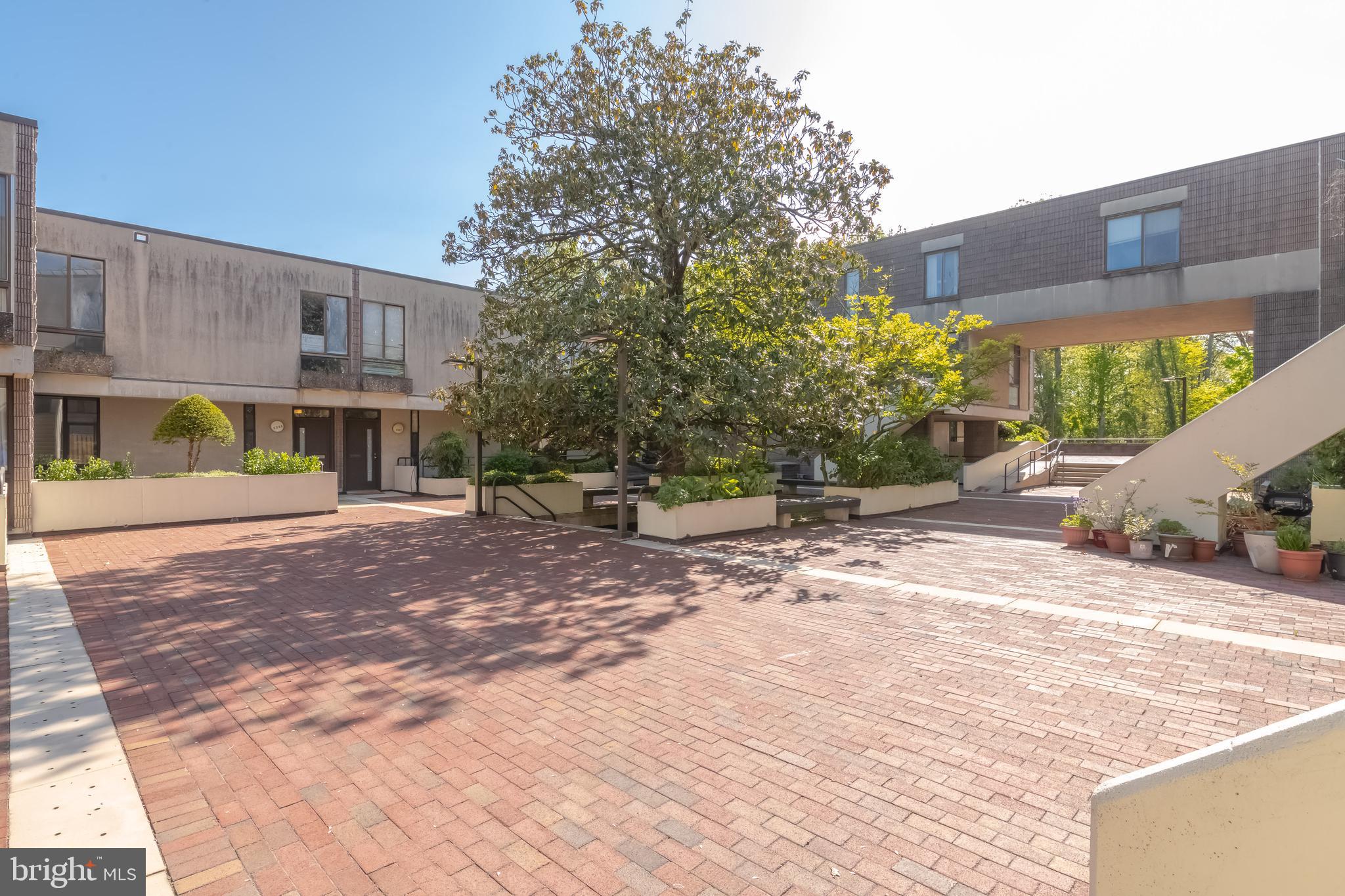 Back on the market - buyer changed mind. Don't let that stop you! Welcome to ColdSpring, Newtown, one of Baltimore City’s best-kept secrets—an established yet evolving community offering a unique blend of suburban serenity and urban convenience. Nestled in Northwest Baltimore, ColdSpring is a master-planned community designed to foster a strong sense of community while providing easy access to major city amenities, where each unit offers its own special footprint and appeal. You will be pleasantly impressed as the new owner of 2357 Nutmeg Ct tastefully renovated unit that features a lower level covered parking w/entry to unit from garage. Roof, Exterior, Water and Garbage are maintained by Coldspring Condominium. Among the most striking features is known for it's "deck house" design which showcases the architectural styling of Moshe Safdie. This community features contemporary architecture, lush green spaces, and a layout designed for walkability. This spacious three-bedroom, two-full and one-half-bath deck house has been tastefully renovated and boasts a main level entry that opens onto a charming brick Terrace and beautiful Magnolia and Tulip trees plus benches at the front. Your rear private courtyard terrace features a raised fenced courtyard creating the perfect sanctuary and leading to a serene park-like open space. Step inside to discover a captivating neo-traditional floor plan where the dining area seamlessly flows into the open kitchen. Adorned with all new raised panel cabinets, silo stone counters and all new appliances blend seamlessly to your front dining adding both functionality and charm to the space. Enjoy abundant natural light streaming in through large windows, illuminating the open floor plan. Revel in the comfort provided by recently serviced utilities while appreciating the convenience of reserved garage parking accessible from the lower level, where you'll also find a convenient laundry room. Bathrooms have been tastefully updated w/new commodes, vanities & Shower/Tub inserts for modern convenience. The main level boasts luxurious vinyl wood flooring, while the upper level and lower level stairs are adorned with brand new carpeting, adding warmth and comfort throughout the home. Your assigned parking is #25 . The fence, yard, and back stairs are yours to enjoy and maintain , but owned by the condominium community (limited common elements). Relax knowing that your Condo Fee covers so much and the Association is responsible for the water & sewer charges, pool and grounds maintenance, porter service (cleaning, watering, handling trash, routine common area maintenance), Master Policy Insurance, landscaping, lawn mowing, snow removal and terrace & steps maintenance, Exterior walls, landscaping of common areas, parking areas, roofs, roof drainage pipes and Skylights. Residents enjoy access to well-maintained common areas, playgrounds, and walking paths throughout the community. Located just minutes from I-83 and I-695, providing easy access to downtown Baltimore and surrounding areas. Close proximity to shopping, dining, and entertainment options, including The Shops at Quarry Lake and The Rotunda. Nearby parks and trails like Clyburn Arboretum, the Jones Falls Trail, nearby hospitals like Sinai, Johns Hopkins Downtown and UMBC. Start packing! Come in, look around, fall in love, ask questions and lets make 2357 NUTMEG TERRACE your NEW HOME.