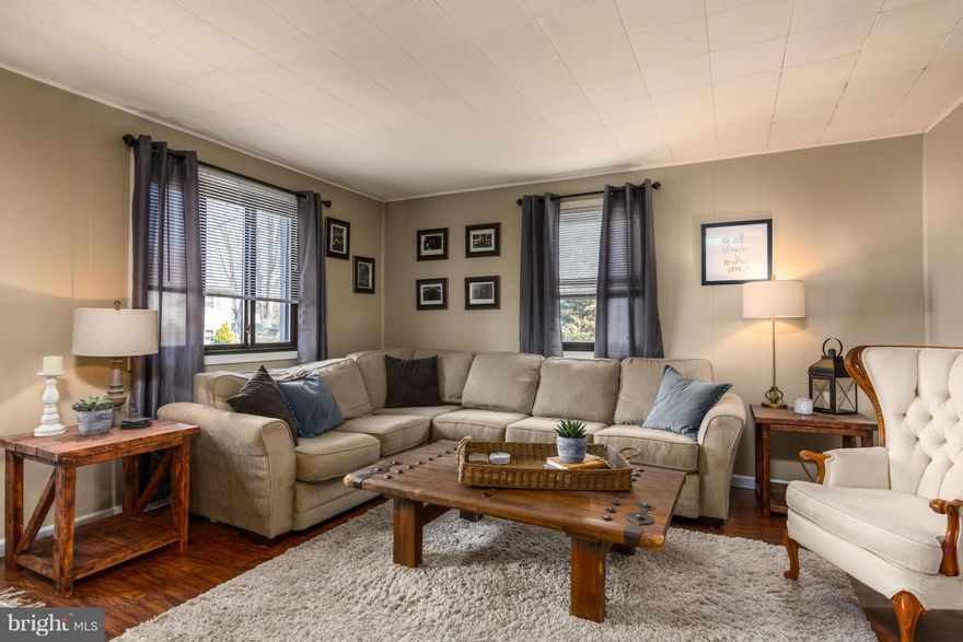 Cape Cod home with tons of character!  Floors, HVAC, water heater, and appliances all new in the last five years.  Updated bathrooms and light fixtures on both levels.  Large FLAT  fenced yard - great for a possible garage/carport.  Large brick patio with lots of room for entertaining.  Pellet stove included - which provides warm heat and a lower electric bill.