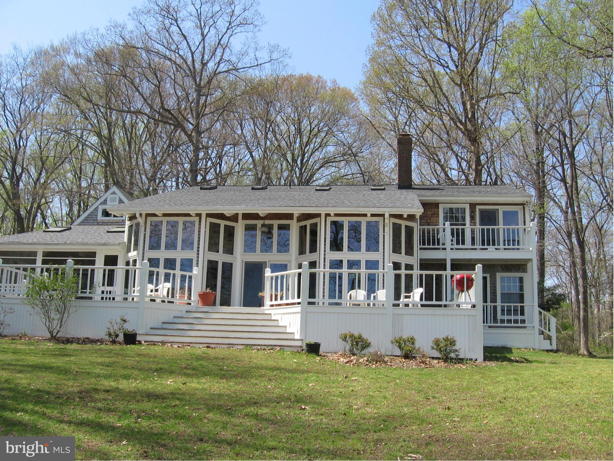 Remarkable custom built post & beam home w/ oak bead board trim. Private WF w/ perfect elevation/view. Floor to ceiling windows provides abundant natural light. Huge WATERFRONT deck for entertaining.Incredible features like wide plank wood floors, skylights & custom cabinets.Large screened porch.3 car garage, fully equipped detached wood shop.PRICED TO SELL + new appliance allowance.