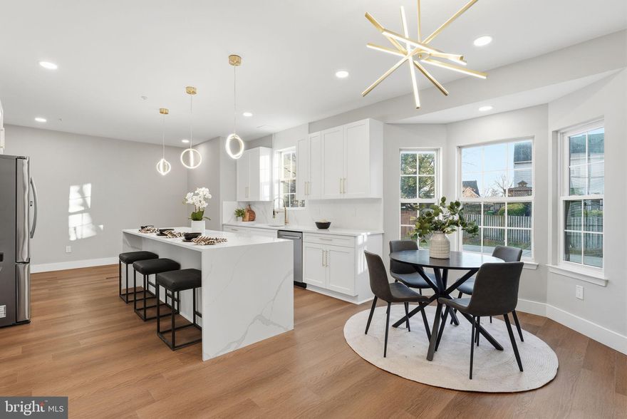 Beautifully renovated brick Cape Cod offering 5 bedrooms, 3.5 bathrooms, and a fully finished basement—designed to deliver modern luxury and exceptional living space in a highly desirable location just minutes to D.C. Step inside to an open and airy layout featuring wide-plank flooring, recessed lighting, and a fresh contemporary palette throughout... The upgraded gourmet kitchen showcases quartz countertops, stainless-steel appliances, stylish tile backsplash, and premium cabinetry—flowing seamlessly into bright living and dining areas ideal for both entertaining and everyday comfort...The highlight of the home is the stunning primary suite, boasting a spa-inspired bathroom with a freestanding soaking tub, oversized walk-in shower with designer tile, dual vanities, gold modern fixtures, and a statement lighting package. All additional bedrooms are generously sized and beautifully updated, offering flexibility for guests, a home office, or multigenerational living.... The fully finished basement expands your living options with multiple flex spaces—perfect for recreation, gym, theater room, or additional guest accommodations—plus a stylish full bathroom for added convenience. A main-level powder room adds function for guests.... Outside, enjoy an updated driveway parking, fenced yard space, and a location that brings urban convenience and quiet neighborhood living together seamlessly. Close to Metro, shopping, dining, parks, and commuter routes.... Completely move-in ready with every detail thoughtfully selected—this is modern living at its finest.... Don't miss your opportunity to check out this stunning home and call it your own!