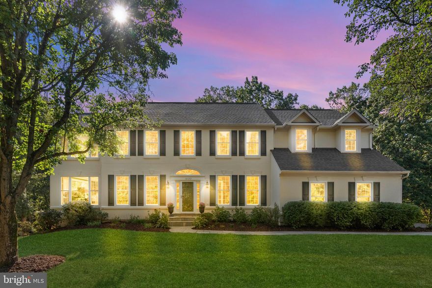 Welcome to 12123 Windsor Hall Way—a beautifully updated Grand Hamptons Langley model tucked away on a premium 0.57-acre lot, where mature trees and the gentle flow of Sugarland Creek create a serene natural backdrop. From the moment you arrive, this residence welcomes you with timeless elegance, refined warmth, and over $200,000 in meticulously curated upgrades completed within the past three years—offering a seamless blend of luxury and lasting peace of mind.

Step inside and imagine the rhythm of daily life flowing effortlessly from one sunlit room to the next. The main level sets the stage for both lively gatherings and quiet evenings at home—gleaming hardwood floors carry you from the formal living and dining rooms to the heart of the home. Here, a renovated kitchen opens to a vaulted family room with a cozy fireplace, the perfect spot to gather after dinner or watch the seasons change through the top-of-the-line Pella windows. French doors invite you to step into the sunroom and out onto the entertainer’s Trex deck, where mornings begin with coffee and evenings end under the stars.

Upstairs, the spacious owner’s suite feels like a private retreat, complete with a sitting area, wood floors, and a spa-like bath to unwind in after a long day. Three additional bedrooms—each with en-suite or Jack-and-Jill layouts—offer comfort and privacy for family and guests alike.

The walk-out lower level extends your living space with a large recreation room ready for game nights, a brand-new full bath (2025), and room to create a future fifth bedroom or home gym. There’s also abundant storage, keeping everything neatly tucked away.

This home has been lovingly maintained and extensively upgraded: dual HVAC systems (2022), Tri-Zone system (2025), a whole-home humidifier (2024), fresh paint (2025), new windows (2022), a new full suite of appliances, upgraded security, landscaping improvements, and so much more—all crowned with a new roof (2019). Every detail has been handled, so you can simply settle in and enjoy.

Outdoor living is just as inviting. Relax on the wrap-around deck, curl up with a book in the screened porch, or host summer barbecues on the slate patio while the private backyard offers space to play, garden, or just breathe in the peace of nature.

And when it’s time to venture out, you’re nestled in a welcoming neighborhood within the coveted Langley school pyramid, minutes from commuter routes, Metro, and downtown Herndon’s shops, dining, and vibrant community events.

This isn’t just a house—it’s a retreat, a gathering place, and a home ready to be part of your story. Mortgage savings may be available for buyers of this listing.