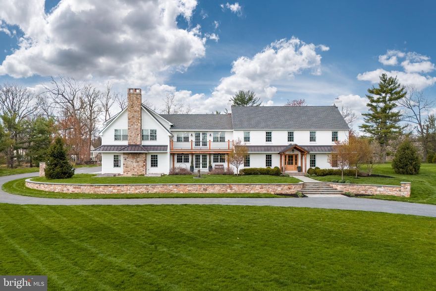 Situated prominently in one of Saucon Valley’s most desirable neighborhoods, this magnificent MODERN FARMHOUSE on 4.72 acres exudes refined yet comfortable living. RENOVATED IN 2019 with soaring ceilings, random-width honey oak floors, lavish lighting, and premium finishes, every detail has been meticulously considered. The kitchen and dining area boasts vaulted, AMISH HAND-CRAFTED POST-AND-BEAM construction, top-of-the-line appliances, dual center islands, and a brick wood-burning fireplace. Additional first floor features include an expansive living room with built-ins, a cozy family room, a mudroom and laundry, two powder rooms, and front and back staircases, all BEAUTIFULLY DESIGNED with quality materials. Private circular stairs lead to a jaw-dropping primary suite with sitting area and private balcony, providing a sanctuary of comfort and relaxation. A magnificent walk-in closet and spa-like en-suite bath awaits, complete with radiant flooring and a striking glass and tile walk-in shower. Four additional bedrooms, two with private baths, a hall bath, and a COZY LOUNGE/STUDY AREA complete the second level. Entertainment awaits in the lower level with a sizable recreation room and home MOVIE THEATER. Welcome home to luxury living on Apple Tree Lane.