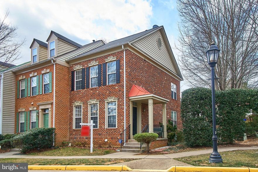 Prepare to be amazed by this North Reston beauty! 4 levels of spacious, stylish, comfort greet you the moment you step into this 2 sided, end unit, brick town home! Rich hardwoods on the entire main level, extensive architectural moldings, stylish paint colors, tall ceilings, numerous windows and more will welcome you! Step into the fully upgraded, gourmet kitchen with gorgeous quartz counter top, island, white, soft close cabinetry, chic backsplash and stainless steel appliances. Large pantry will accommodate all your storage needs. The open concept, main level extends into the large living and dining room. You will enjoy all the light that will stream in from the many windows and door to the patio. There s also a powder room on the main level. The upper level offers dual bedroom suites! The larger master bedroom has soaring, vaulted ceilings, dual walk in closets and a stunning, unique spa master bath in the private loft! Dual vanities, separate soak tub and shower and a water closet in addition to a large walk in closet will make you want to linger!Don t forget to check out the attic storage area! The fully finished basement offers a spacious rec-room with gas fireplace, a separate den which can work as a bedroom or office, a full bath and separate laundry room. Enjoy the outdoors with a spacious patio and fully fenced backyard. Home is wired for audio. Recent updates include : New Carpet - 2019; Kitchen - 2016; Paint - 2017; Blinds - 2017; Second bath - 2019; Light fixtures - 2019; 2 Assigned parking spots plus plenty of guest parking available! Home is move in ready! Close proximity to Reston Town center, the upcoming Silver line metro, shopping, restaurants and more await you in this great location!Come see the home today and all that Reston has to offer!