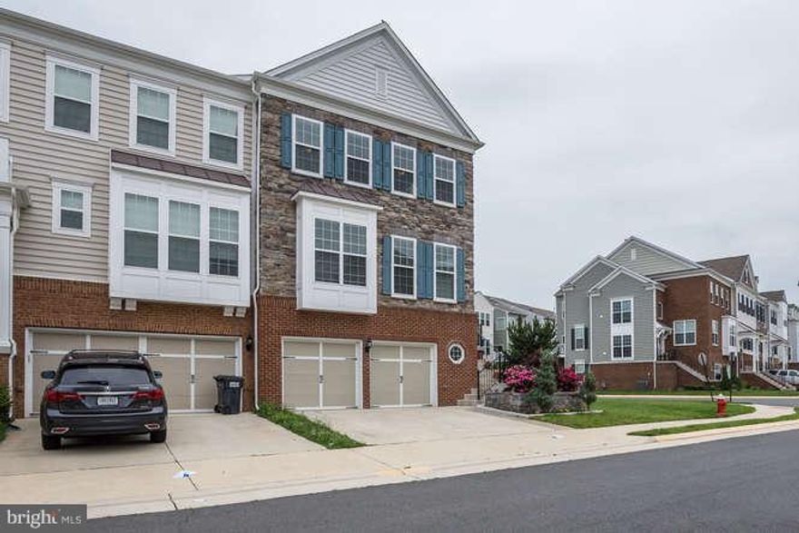 HUGE END TH WITH STONE FRONT AND SIDE *BIGGER THAN MOST SF*2 CAR GAR*UPGRADES GALORE*3-LEVEL BUMP-OUT*HDWD FLOORS MAIN LEV*CHAIR RAIL MOLDING AND CROWN MOLDING*OFFICE* KIT.W/GRANITE/SS APLIANCES*CUSTOM PARTY DECK AND SLATE PATIO*DROP DEAD GORGEOUS LAND SCAPING *FULL FIN W/O LOWER LEV HAS BR & FULL BA*EXTENDED STORAGE IN GAR* FENCED BACKYARD COMM.POOL & TOT LOT* text showing contact.