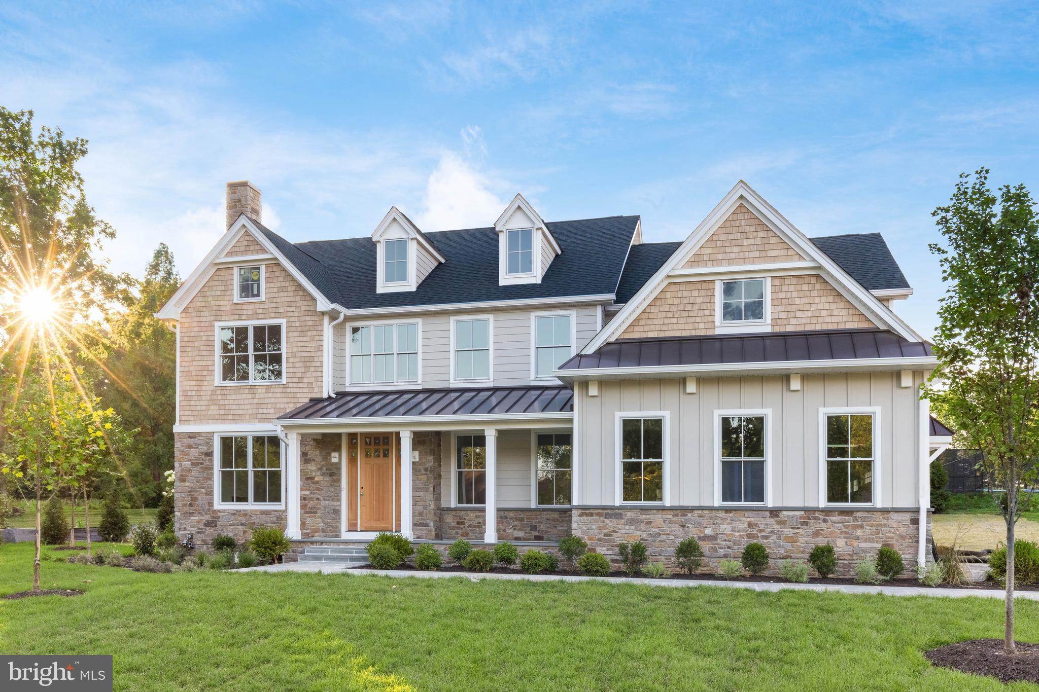 NEW CONSTRUCTION IN RADNOR – October 2025 Delivery!
Experience elevated Main Line living in this exceptional new construction home by the highly regarded Rockwell Custom, perfectly situated in the heart of Radnor Township on a quiet, horseshoe-style street in the sought-after North Wayne neighborhood.
From the moment you arrive, the home's striking curb appeal and inviting front porch set the tone for what lies within. Step inside to a sun-drenched open floor plan featuring wide-plank hardwood flooring, abundant natural light, and custom craftsman trim details throughout. To your left, a flexible living room with a fireplace offers the perfect space for a formal sitting area or a private home office. To your right, an elegant dining room sits just beyond a show-stopping staircase.
The back of the home opens into a stunning great room with coffered ceilings, a cozy fireplace, and seamless flow into the gourmet kitchen. Designed for everyday luxury and entertaining alike, the kitchen features a custom oversized island, premium cabinetry, and professionally curated fixtures that elevate the space.
Step through to the covered rear flagstone porch with a gorgeous stone fireplace—an ideal setting for year-round indoor-outdoor living.
Upstairs, the primary suite is a true retreat, complete with two walk-in closets, a vaulted ceiling, and a spa-like ensuite with a soaking tub, dual vanities, and a water closet. Four additional bedrooms and three full baths offer ample space for family and guests, along with the convenience of a second-floor laundry room.
The finished lower level is built for entertaining, complete with a custom bar included in the price and flexible space for a home theater, gym, or game room. Additional unfinished areas provide generous storage.
Located just minutes from Wayne’s premier dining, shopping, and entertainment, this home offers a rare opportunity to own a thoughtfully crafted, move-in ready luxury residence on the Main Line.
Anticipated completion: October 2025.
Reach out today to learn more about the high-end finishes included in this home—or schedule a private tour!