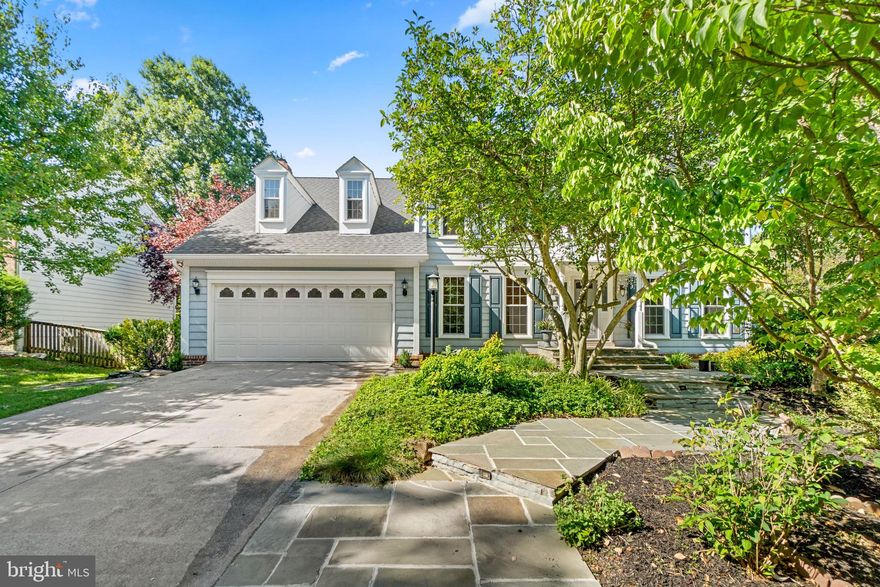 Set in a cul-de-sac with gorgeous landscaping creating a personal retreat on a .38 acre landscaped homesite in Burleigh Manor is this traditional colonial offering a flagstone walkway, and a Home Warranty for added peace of mind. A charming covered front porch welcomes you inside this 4,252 sqft modern colonial presenting fine finishes, crisp white moldings, enriched hardwoods, an abundance of heightened windows allowing the natural light to fill each room, and a 2-story foyer accented by a turned staircase. As you explore the main level, you find a formal living room, a private study, a formal dining room trimmed with crown molding and chair rail trim, and a stunning family room enhanced by a brick surround wood burning fireplace flanked by Palladian topped windows with wood louvre shutters, a breezy ceiling fan, and several walkouts to a rear sunroom. Cool wide plank tile flooring and a cathedral ceiling invite you into a brilliant sunroom brightened by a wall of windows framing the backyard view, a walkout to a tiered deck with built-in seating, a sizeable stone patio, and a fenced backyard with a paved basketball pad adding to the outdoor entertainment. Equipped with stainless steel appliances including a downdraft cooktop, this gourmet kitchen features granite counters, a planning desk, a center island with a breakfast bar, custom raised frame 42” white cabinetry, a huge pantry, and an open breakfast room with a bay window and serene backyard views. Owner’s suite presents a cathedral ceiling with a drop fan, a sitting area, two walk-in closets, a breezy drop ceiling fan, and a luxe bath displaying a double sink vanity, a separate shower, and a jetted tub. Lower level features a spacious rec room with a wet bar, a bonus room, an exercise room, a full bath, a home office, and a laundry room with additional storage space. Enjoy the exterior venues including a deck, a paver patio, a spacious backyard with a second patio perfect for a fire pit, a tree-lined homesite for added privacy, and a premier location, this home offers many amenities and is conveniently situated only minutes from major commuting routes, dining, shopping, golf courses, and airports. Welcome to new memories!