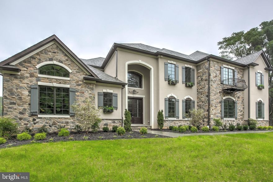 Absolutely gorgeous home with so many wonderful features and amenities.  You just have to see it!  Custom home with the finest finishes throughout.  Extraordinary attention to detail and sophisticated design with a contemporary flair.  10 foot ceilings, open floor plan, fabulous kitchen with SubZero/Wolf professional appliances including built-in coffee station and mother of pearl backsplash!  All upstairs bedrooms have ensuite baths, quartz countertops and huge walk-in closets.  The Master Bath is amazing with inlaid marble mosaic floor, a huge two person air jet tub and party shower with multiple fixtures. The bright sunlit rooms include a large first floor study with vaulted ceiling and expansive family room with coffered ceiling.  The banquet size dining will hold any dinner party and the enormous mudroom includes a drop off area with cubbies and a large walk-in closet. On the exterior, you will find natural stone, a wrought iron balcony and a 60 foot long Tree deck.  Call for your private showing.