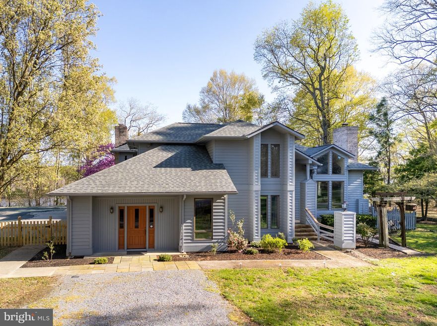 Nestled on over six acres of pristine land with direct access to the Choptank River, this contemporary waterfront estate offers the ultimate in Eastern Shore luxury living. Designed to impress, the home features four spacious bedrooms, three and a half baths, and soaring cathedral ceilings that crown a dramatic two-story living room with floor-to-ceiling windows—flooding the home with natural light and showcasing stunning views of the surrounding landscape.

Perfect for both relaxation and entertaining, the open-concept main living area flows seamlessly into the dining room and a gourmet kitchen equipped with a large center island, custom cabinetry, abundant storage, and a bright breakfast area. Four fireplaces—including one in the cozy family room—add warmth and character throughout the home. A dedicated billiard room with direct outdoor access offers a versatile space that could also serve as an art studio, media room, or more.

The expansive primary suite is a true retreat, featuring a private marble bath, separate workout and tanning rooms, and peaceful garden views. Bedroom flexibility, built-in features, and an upstairs suite with en suite bath offer options for multi-generational living or hosting guests with ease.

Outdoors, enjoy your private, fenced backyard oasis complete with a sparkling in-ground pool and a deep-water dock—ideal for boating, kayaking, or simply soaking in the tranquil beauty of the riverfront setting.

Additional amenities include a detached garage with a second-floor loft perfect for storage, studio space, or a workshop, and a separate shed for tools and equipment. Located just outside the town of Denton, you’re only minutes from charming shops, dining, and state parks, all while enjoying the privacy and serenity of a secluded waterfront lifestyle.

This is a rare opportunity to own a truly remarkable Eastern Shore property where luxury meets nature.