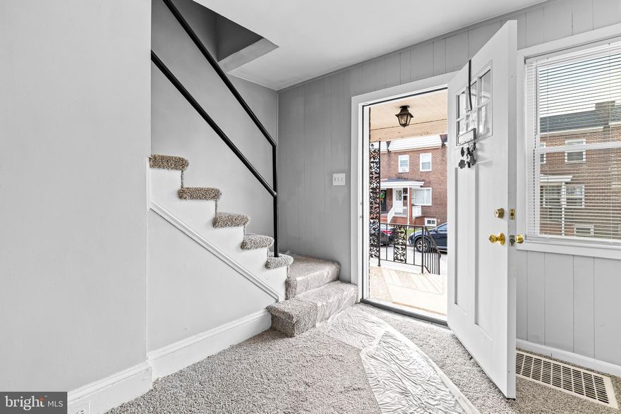 Welcome to this warm and inviting townhome nestled in the charming Dundalk Highlands. Perfect for first-time homebuyers or investors seeking a turn-key opportunity! This delightful 2-bedroom, 1-bathroom townhouse comes with multiple upgrades. Enjoy a freshly painted interior, and a brand new kitchen complete with modern cabinets and appliances, including a gas range, dishwasher, microwave, and refrigerator. New ceiling fans throughout the home provide a refreshing breeze! All ceiling tiles are new and the home has replacement windows. The bathroom has been refreshed with a new vanity, cabinets, and paint. That's not all! The inviting brand new carpet adds a touch of sophistication and softness throughout the home, and the finished basement offers additional living space for an office, den, or playroom. The concrete parking pad provides off street parking , while side walks invite leisurely strolls through the neighborhood. This property also features a charming front porch, and a deck, perfect for sipping morning coffee or enjoying evening sunsets. Move in and enjoy comfort and style in a home and friendly neighborhood that's ready for you!  PROFESSIONAL PHOTOS COMING SOON!