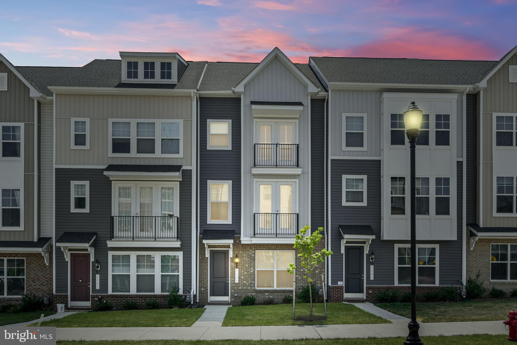 Fantastic! This townhome built in 2023 shows like a model! As soon as you walk inside, you will immediately notice its pristine condition. On the entry-level, you'll find a private retreat with a generously sized bedroom and a full bathroom, perfect for guests. The second level features upgraded luxury vinyl plank flooring and an open-concept floor plan with separate living and dining areas. The kitchen is a gourmet chef's dream with stainless steel appliances, white cabinetry, a spacious center island, quartz countertops, and a large walk-in pantry. The dining room and family room provide plenty of space for everyday living or entertaining guests. The family room is well thought-out and features pre-wired TV connections and doors that open to provide fresh air and natural light. A convenient powder room completes this level. Upstairs, you’ll find three additional bedrooms. The primary suite features a large walk-in closet and a spa-like bathroom complete with a spacious dual vanity with quartz countertops and plenty of cabinets for storage. The large third and fourth bedrooms provide additional space for family and guests. This level also features a hall bathroom with a tub, a linen closet, and a conveniently located laundry room. Ascend to the top level, where a spacious loft awaits. This area is an entertainer's paradise, complete with an upgraded wet bar featuring quartz countertops. Keeping this area the perfect temperature is easy with its separate thermostat. Step outside to the large rooftop terrace perfect for outdoor relaxation or entertaining. The home also offers a 2-car garage and plenty of on-street parking. The neighborhood dog park is just down the street and this home offers endless entertainment options, situated just a short distance from various shops- including Wegmans- restaurants, and gyms, as well as the charming downtown area of Frederick. With easy access to major commuter routes, this home is a must-see. Don't miss the opportunity to make this stunning house your home!