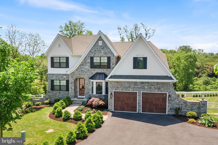 Nestled on a cul-de-sac street amid softly rolling hills, this pristine 4 bedroom, 3.5 bath home in award-winning Avon Grove School District blends elegant design with thoughtful functionality. The impeccably landscaped grounds are further elevated by the home's striking stone facade with welcoming glass panel front door, bay window with standing seam metal roof and distinctive wing walls. 

Step inside to a welcoming entryway anchored by a formal dining room and private home office, both crafted to stand the test of time both in style and function. Beyond the dining room, the heart of the home awaits: an open concept living area designed for sophisticated entertaining and everyday comfort. You'll instantly be drawn to the home's impeccable craftsmanship including coffered ceilings, square panel molding, shiplap accents, designer lighting, five-panel doors and rich, wide-plank white oak hardwood flooring. The gourmet kitchen is a true chef's delight featuring floor-to-ceiling white shaker cabinetry with glass-front uppers, an oversized island with coordinating grey shaker cabinetry, farm sink, luxury quartz countertops, upgraded marble backsplash and sunny morning room with butler's pantry. The open concept transitions effortlessly to the family room incorporating a gas fireplace with custom mantle and eye-catching built-ins. Oversized windows span both rooms flooding the space with natural light and French doors provide access to the covered porch/composite decking that extends across the back of the home. The setting is ideal for indoor-outdoor entertaining, and the rare pond backdrop with fenced-in backyard and custom shed offers an unmatched sense of peace and privacy. Also located on the main level is the primary suite, a peaceful retreat with a spa-inspired bath, walk-in closets and private French doors that open to your backyard paradise. Upstairs, you'll find three generously sized bedrooms, a well-appointed full bath and versatile loft area.  A large unfinished bonus room allows for room to grow and the flexibility to create a space that suits your personal lifestyle. 

Downstairs, the finished walkout basement is a true extension of the home with distinctive design elements that complement the upstairs. The space offers flexibility for everyday living and includes a handcrafted bar with built-in cabinetry and designer backsplash; spacious family room with gas fireplace, custom built-ins and a full bath that adds further functionality to the space. Similar to the main level, there is a wall of windows and French doors that open to a covered paver patio surrounded by a stone knee wall. The perfect combination for seamless indoor-outdoor entertaining, this space also captures panoramic views of the beautifully landscaped backyard and tranquil pond beyond that. Truly one-of-a-kind, 16 Autumn Blaze is a masterclass in design; flawlessly finished, far from ordinary and ready to impress. Make sure it's on your list of "must see" homes to tour! (More pictures to follow)