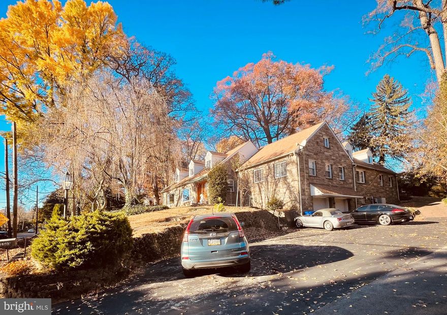 Welcome Home to a Stunning Elkins Park Nestled on a generous ¾-acre lot, this magnificent stone Cape Cod home combines timeless charm with modern amenities. Boasting approximate 6,000 square feet of living space, this property offers everything you need for comfort, entertaining, and relaxation—all within the coveted Montgomery County school district. Property Highlights • 6 bedrooms and 3.5 bathrooms • Gleaming hardwood floors throughout • 3 fireplaces for cozy gatherings • 12’ deep pool with a vintage pool house • Expansive media room with wet bar and scenic views • Spacious finished basement with hobby room, laundry, and garage access Main Floor Features Step inside to discover a welcoming layout perfect for both everyday living and entertaining. The large eat-in kitchen is the heart of the home, offering ample space for family meals or hosting guests. The living and dining rooms feature rich hardwood floors and oversized windows, creating a bright and inviting atmosphere. The primary bedroom suite offers a serene retreat, complete with his-and-hers closets and an en suite bathroom. Additional bedrooms on the main and upper floors provide plenty of flexibility, with ample hallway closet storage throughout. Media Room for Entertaining Above the main floor, the spacious media room is a true showstopper. Featuring: • A fireplace • A bar with seating for 8 • Stunning views of the landscaped property This is the ultimate space for movie nights, game days, or social gatherings. Outdoor Living at Its Best The charm of this home extends outdoors, where a stone patio invites you to enjoy al fresco dining or relaxation three seasons of the year. Follow the pathway to the tranquil pool, a serene oasis tucked away for privacy. Adjacent to the pool, the two-room pool house remains virtually untouched, showcasing its original mid-century tiled showers. Finished Basement and Garage The finished basement offers a cozy fireplace, a dedicated laundry room, and a versatile hobby room. It also provides direct access to the oversized two-car garage, ensuring convenience and additional storage space. Don’t miss the opportunity to own this extraordinary property in Elkins Park. With its perfect blend of historic charm, modern amenities, and outdoor beauty, this home truly has it all.