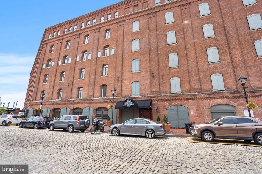 Beautiful two-story penthouse apartment with harbor view right  in the heart of Fells Point! Featuring an updated kitchen with granite counter tops, separate living room with marble fireplace, hardwood floors throughout,  Main level has second bedroom/study with french doors and built-in library, full bathroom with rain shower, and separate laundry room.  Upper level includes the  primary bedroom and bathroom with jacuzzi tub, and huge balcony with a view of the harbor. Unit faces south with lots of natural sunlight. 24 hour security, full gym, and garage parking with one parking space included. Restaurants, shopping and grocery stores all within a short distance from the building! Pets accepted on case by case basis with additional deposit