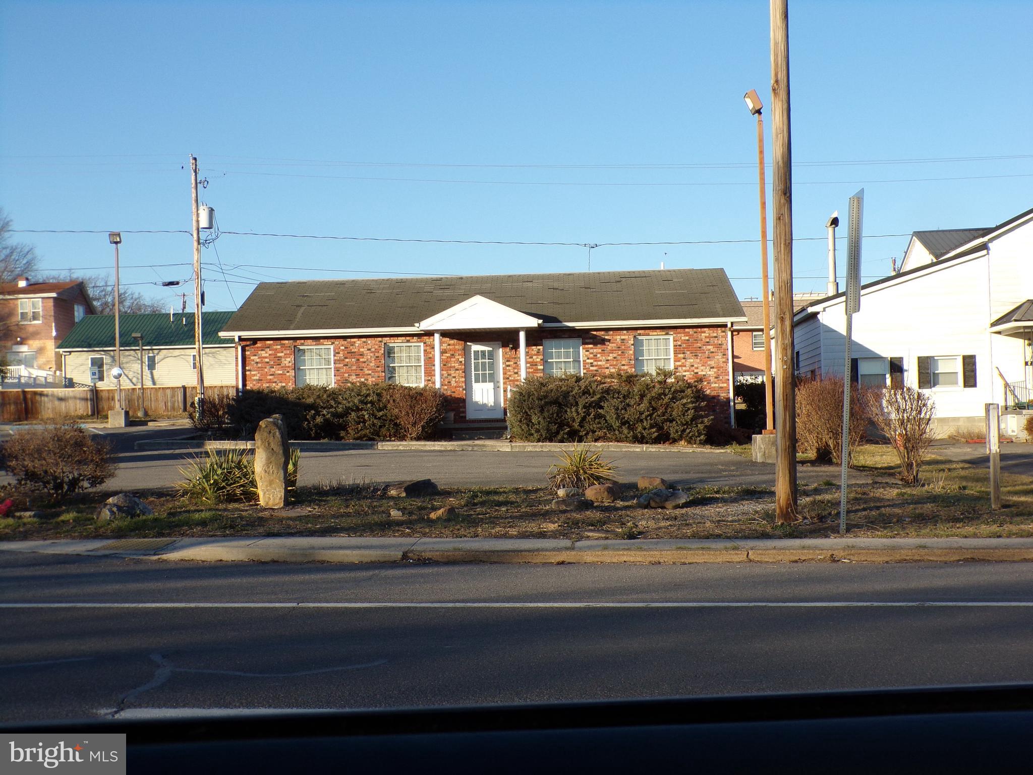 PRICE REDUCED!!! LOCATION, LOCATION, LOCATION - HIGH TRAFFIC, HIGH VISABILITY - Don't miss this opportunity to own this well constructed brick building containing approsimately 1.320 squre feet on each level totaling approximately 2,640. It was formerly used as a real estate office. The potential and possibilities are unlimited! The first floor is finished office space containing reception area, large open space, 3 private offices, kitchen area and rest rooms. There is a large unfinished basement which could be finished into usuable space. Ample parking on the paved lot. The heating and central air is electric forced air. Possible uses could include dental, cpa, insurance, real estate, daycare, medical and many more to numerous to mention.