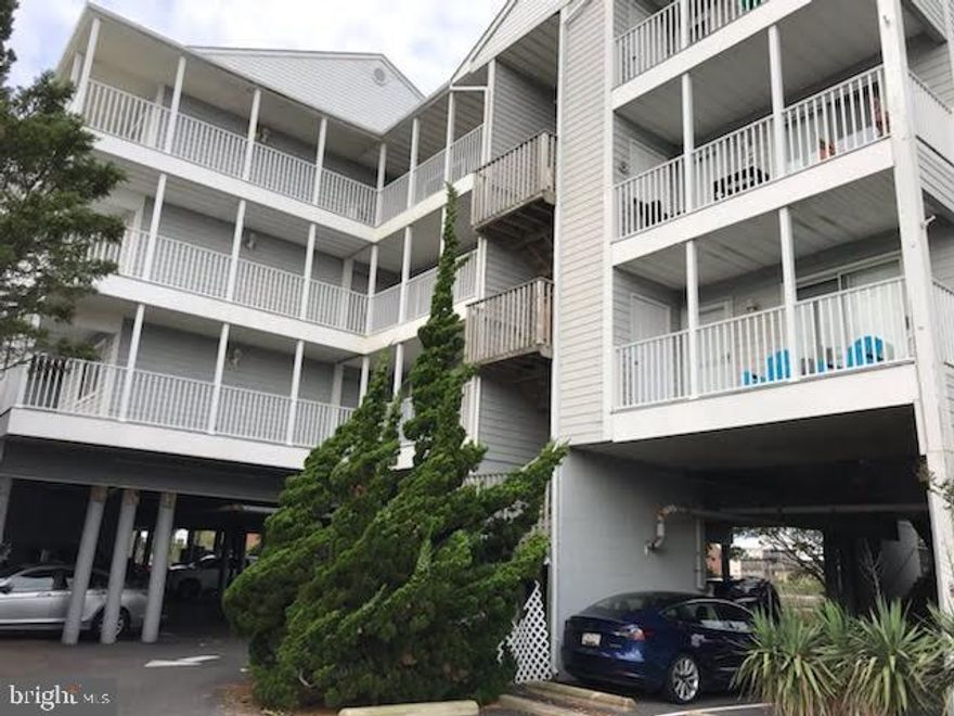 Location is everything and this place has it all! One of the best views of the bay in the area. . .Two short blocks to beach, close to downtown and in a quiet neighborhood. This two bed, two bath condo with amazingly large private porch has room to sleep up to seven people.  Entire condo has been renovated - new paint and flooring throughout.  Master and living room are bay view; other bedroom has private door to 2nd bath. Kitchen is open and nice with lots of storage and all new appliances - 3 person bar and dining room area - living room has same great view.  So nicely laid out! A private dock juts out into the cove with bench at end and there is a private pool accessible through a 2nd exterior door off the porch. Make a few extra bucks as a summer rental and enjoy it as a fall hide-a-way.  Fager's a two minute walk away! Covered parking with numbered spaces and extra space for visitors - loading spaces near convenient elevator. Kayak and bike storage and launch. Close to downtown . . .and two blocks from the ocean. You will love this place. Come see at Open House on August 29 from 2-4!